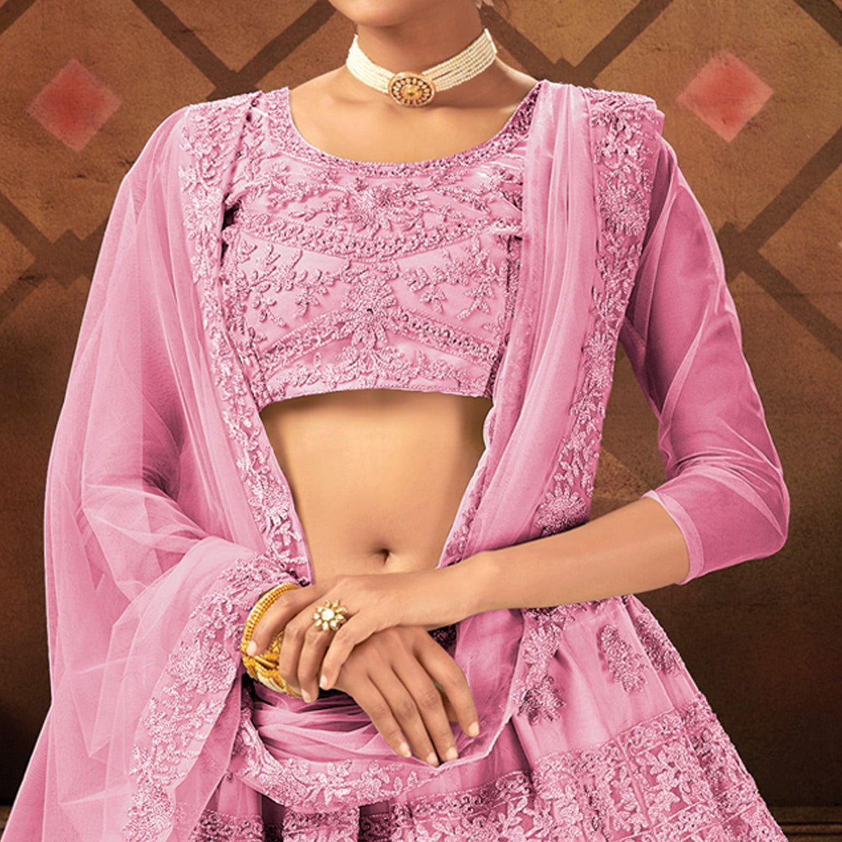 Pink Embroidered Netted Lehenga Choli