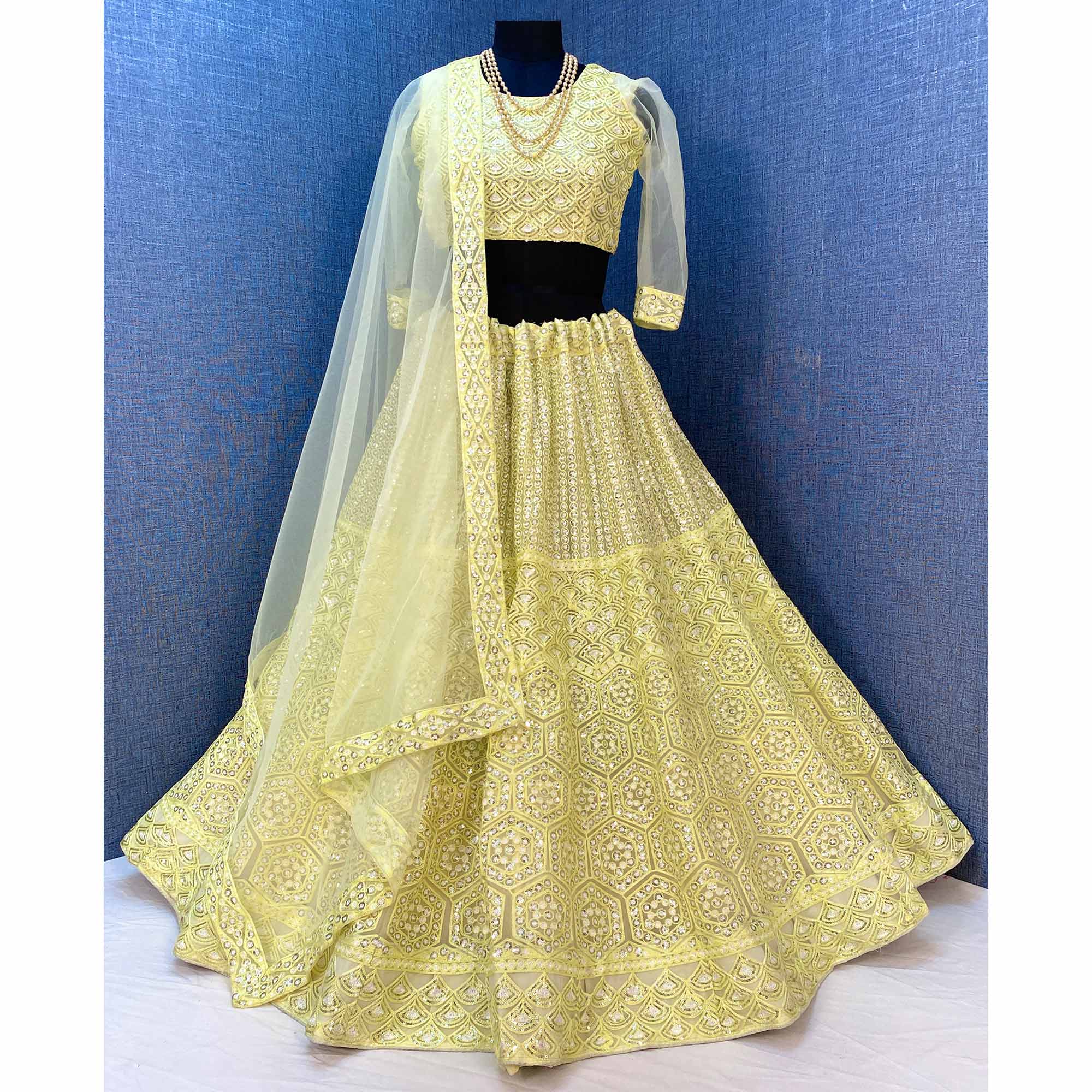 Lemon Yellow Sequins Embroidered Netted Lehenga Choli