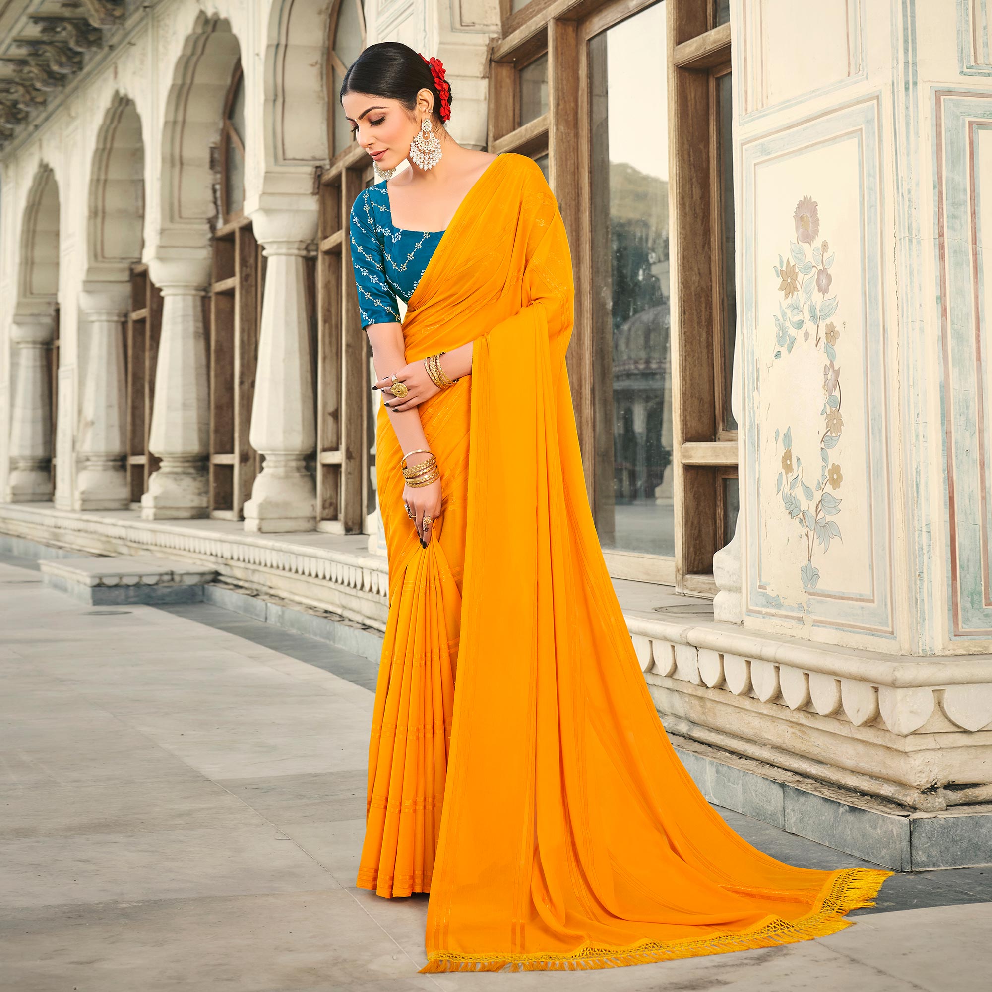 Mustard Printed Georgette Saree With Tassels