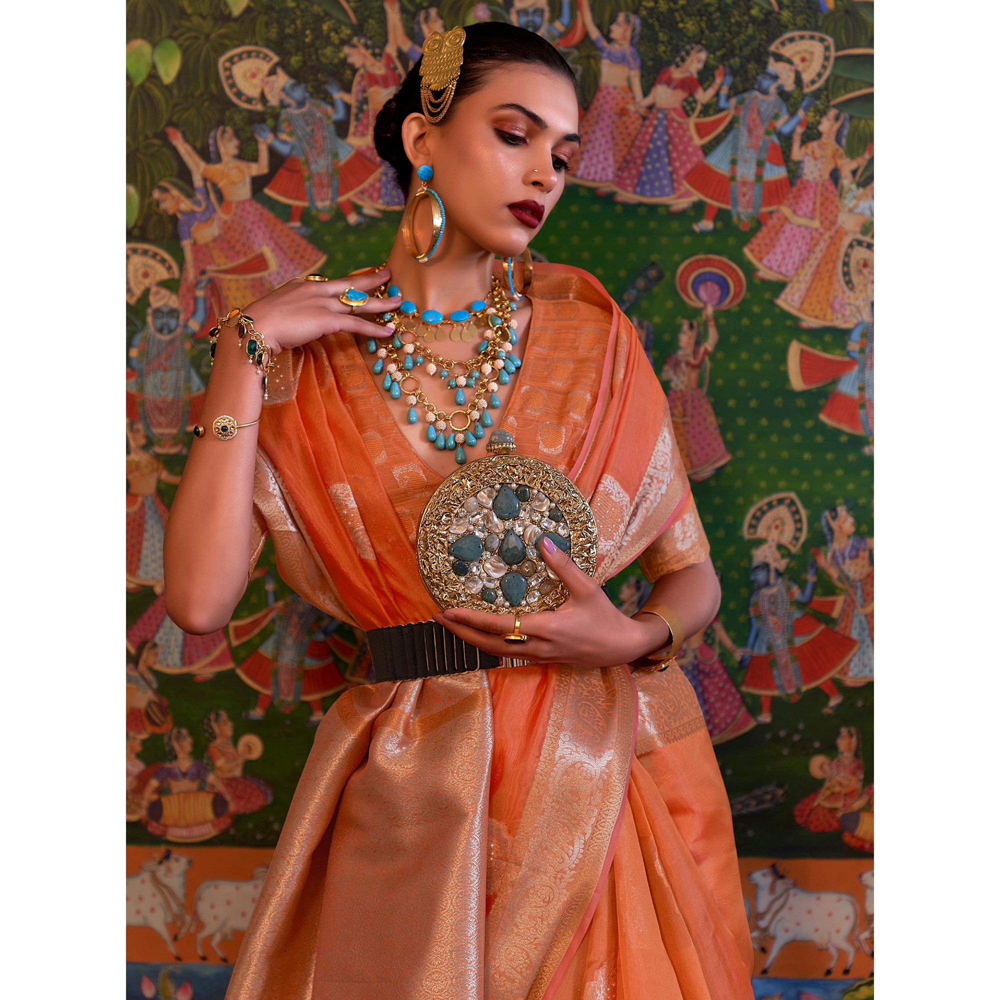 Orange Woven Organza Saree With Tassels