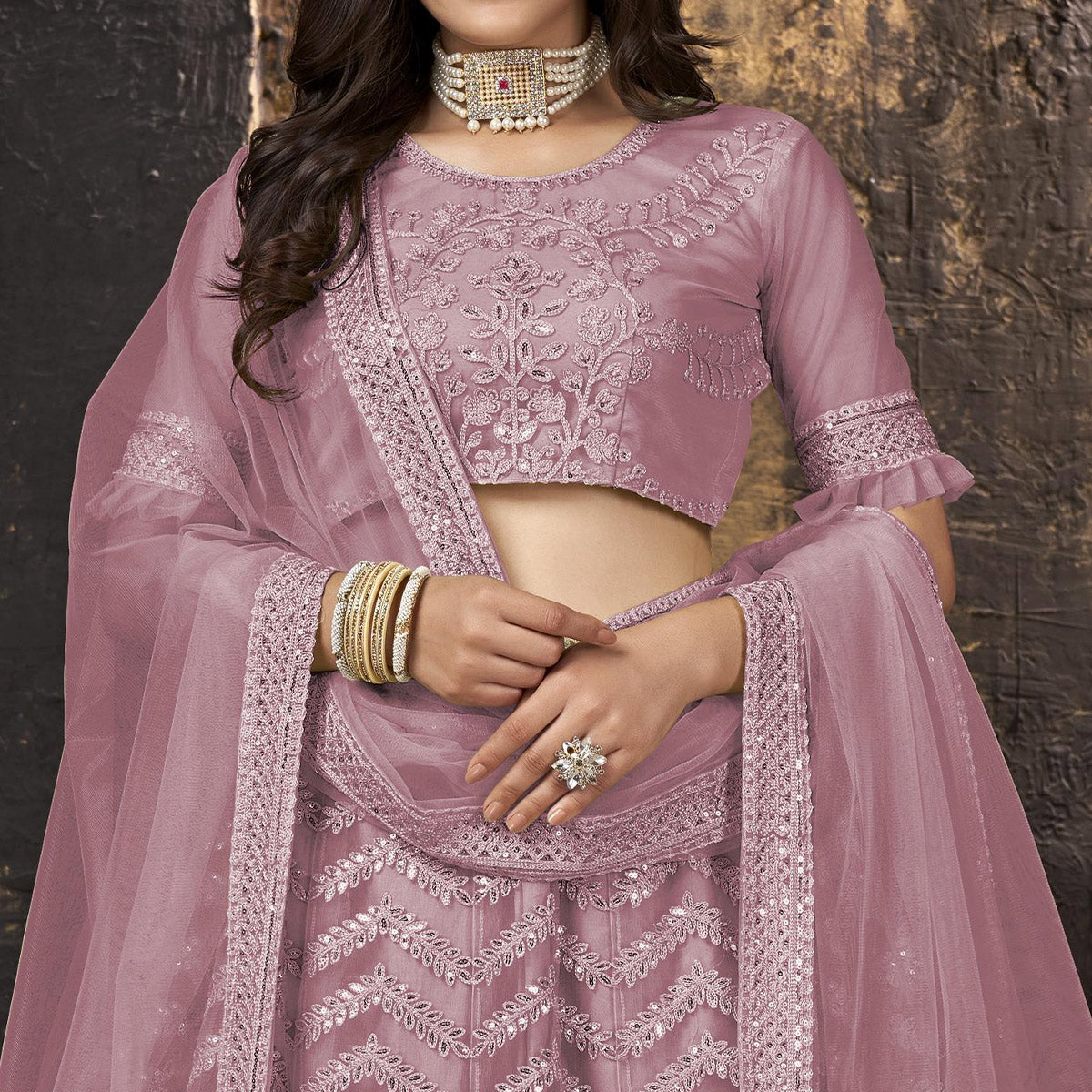 Mauve Heavy Embroidered Netted Lehenga Choli