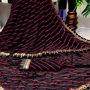 Flamboyant Black Colored Casual Printed Moss Georgette Saree - Peachmode