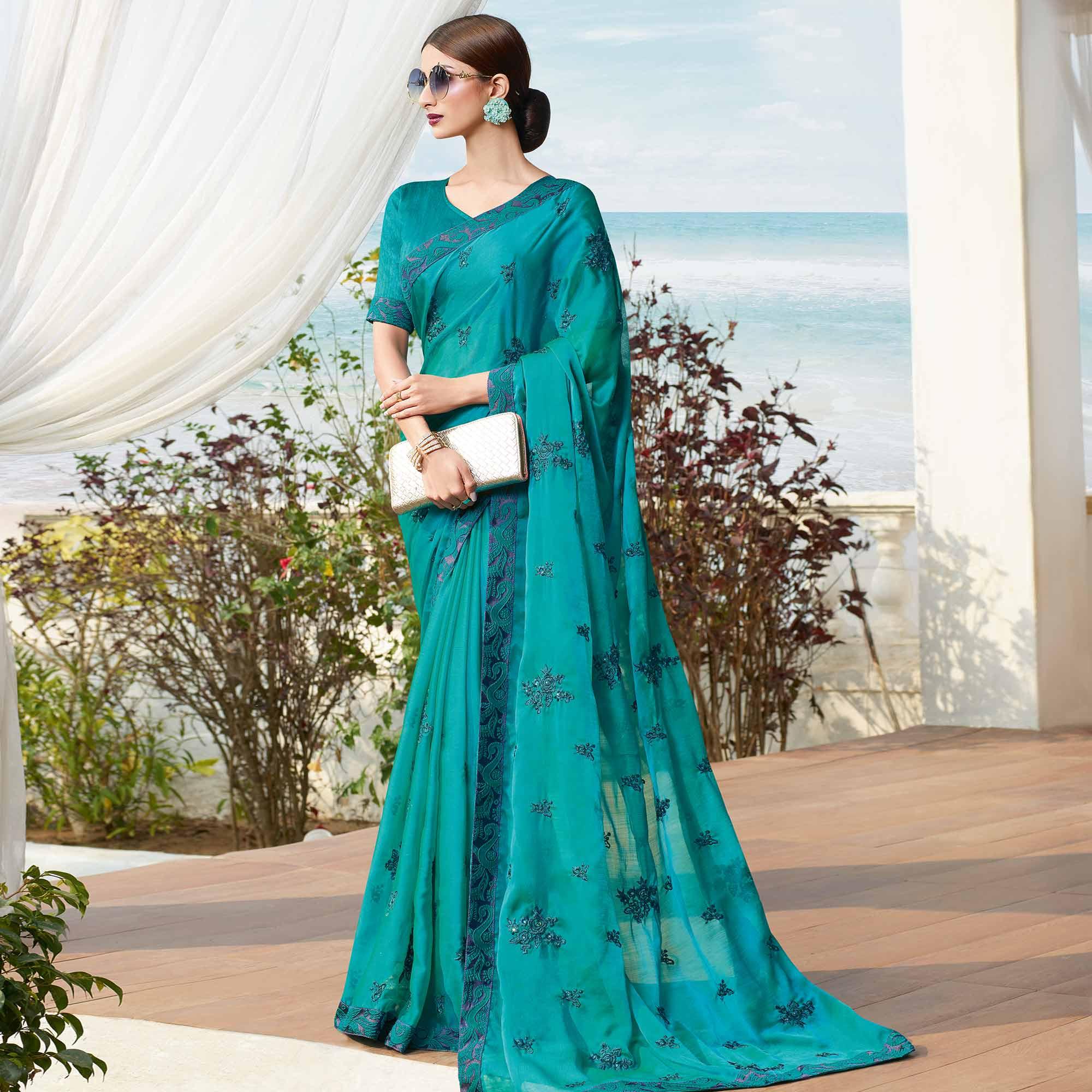 Flamboyant Rama Blue Colored Partywear Embroidered Georgette Saree - Peachmode