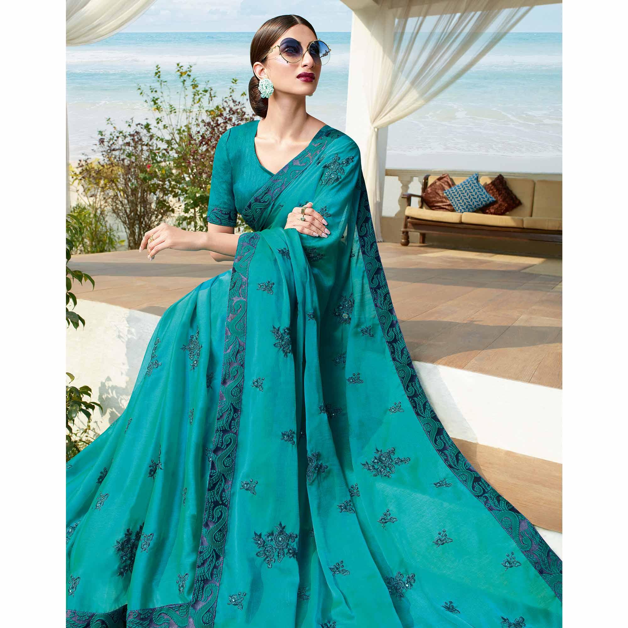 Flamboyant Rama Blue Colored Partywear Embroidered Georgette Saree - Peachmode
