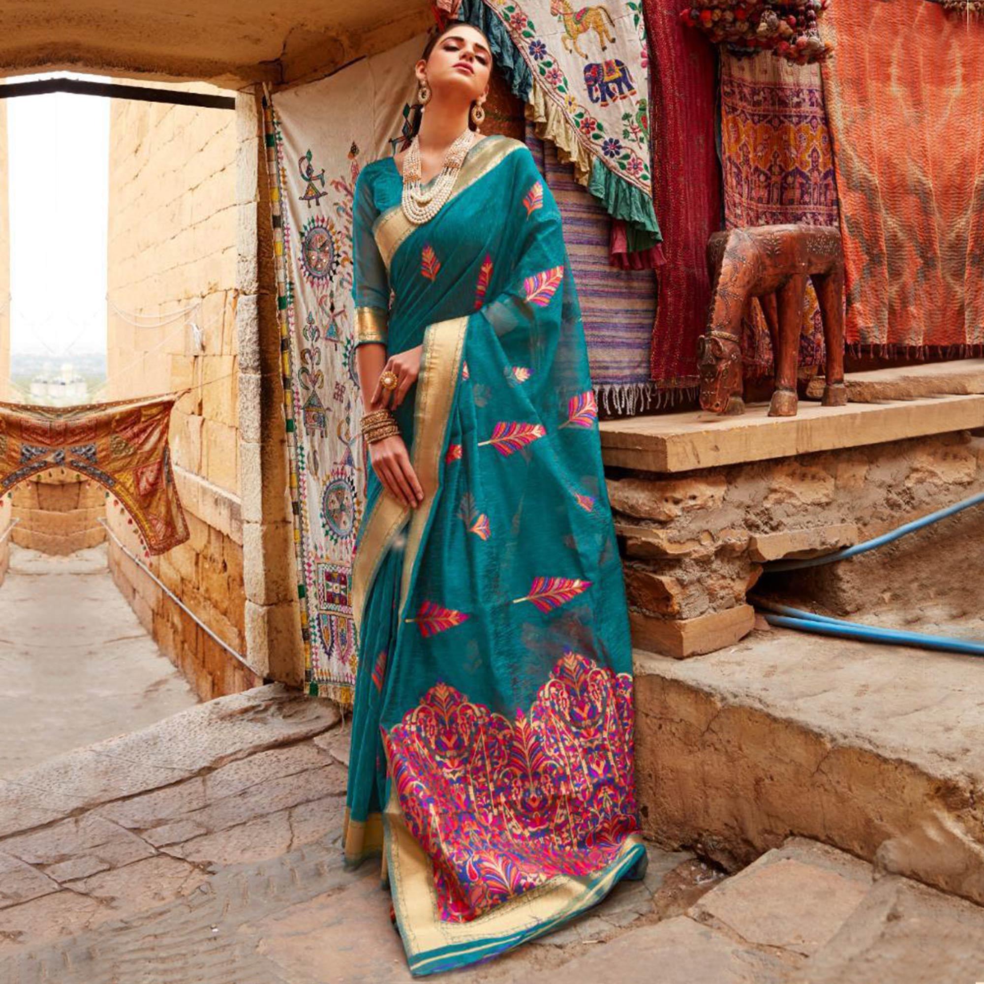 Gleaming Teal Blue Colored Partywear Printed Linen Saree - Peachmode
