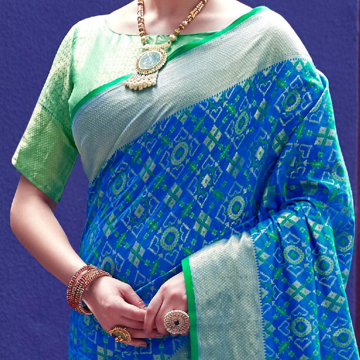 Glowing Blue Colored Festive Wear Woven Indian Patola Silk Saree - Peachmode