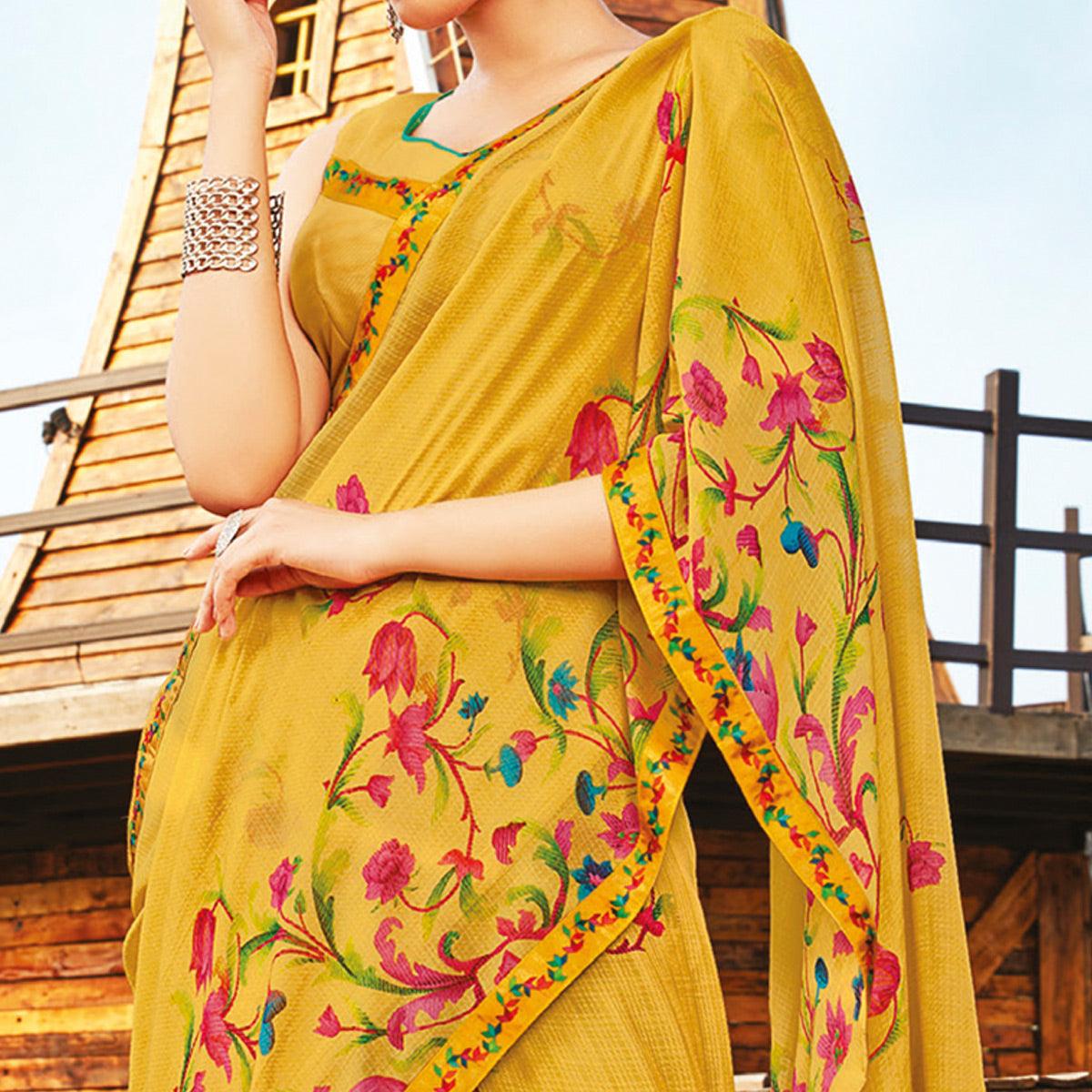 Gorgeous Mustard Coloured Partywear Pure Georgette Floral Printed Saree With Fancy Lace Border - Peachmode