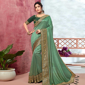 Green Festive Wear Silk Saree With Embroidered Border - Peachmode