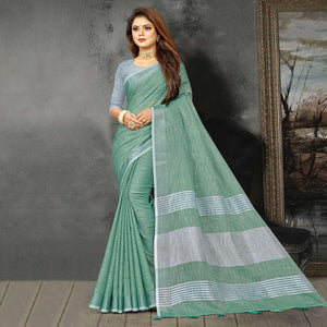 Green Festive Wear Solid Linen Saree - Peachmode