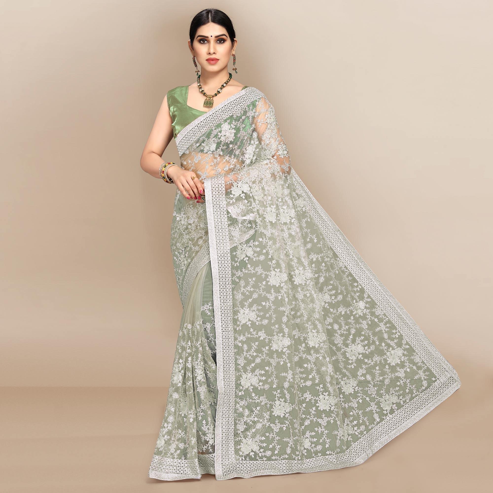 Green Partywear Floral Embroidered Soft Net Saree - Peachmode