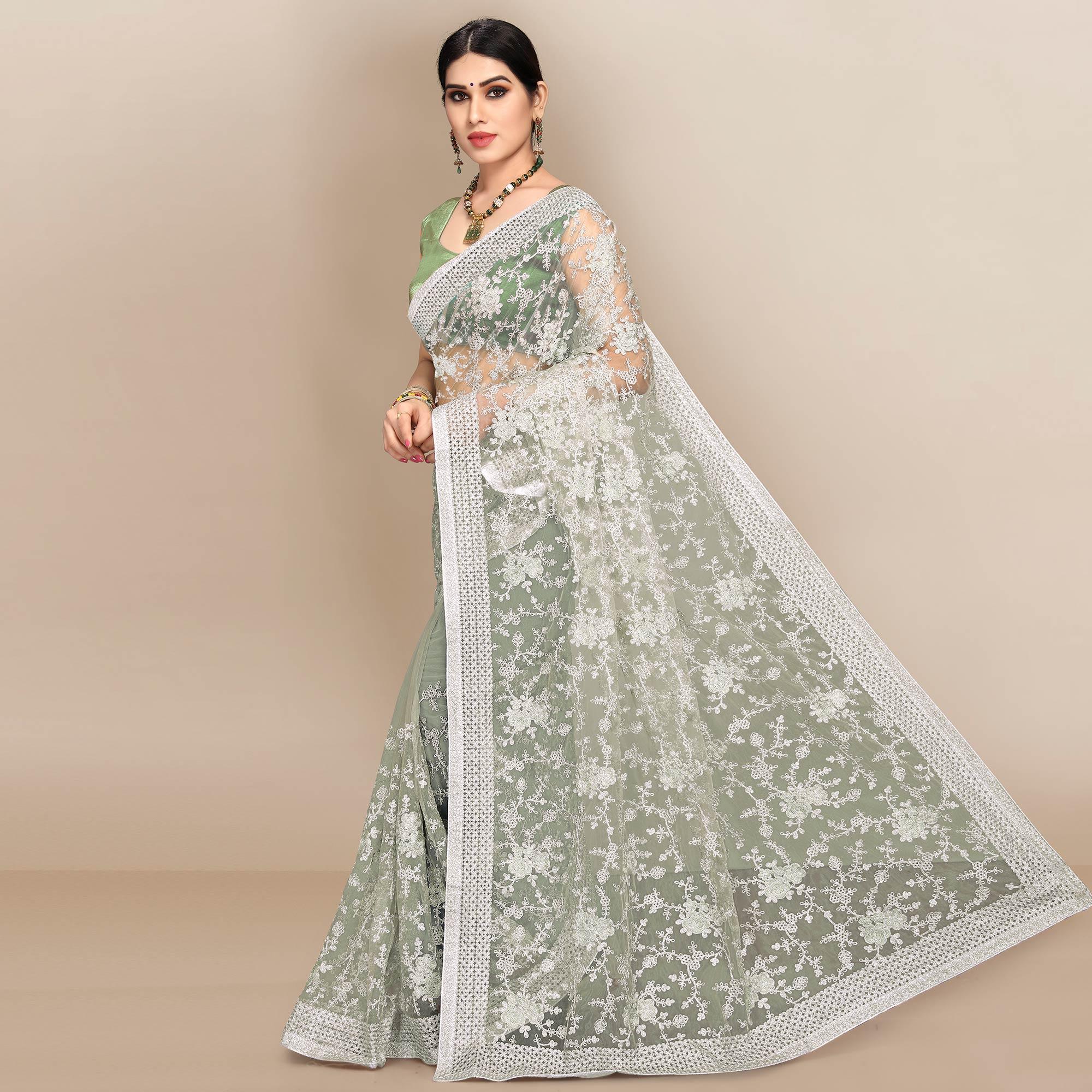 Green Partywear Floral Embroidered Soft Net Saree - Peachmode