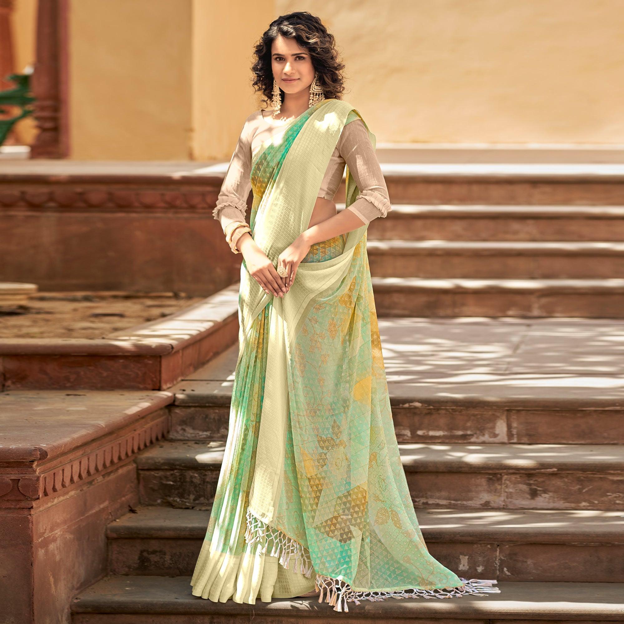 Green Printed Georgette Saree With Tassels - Peachmode