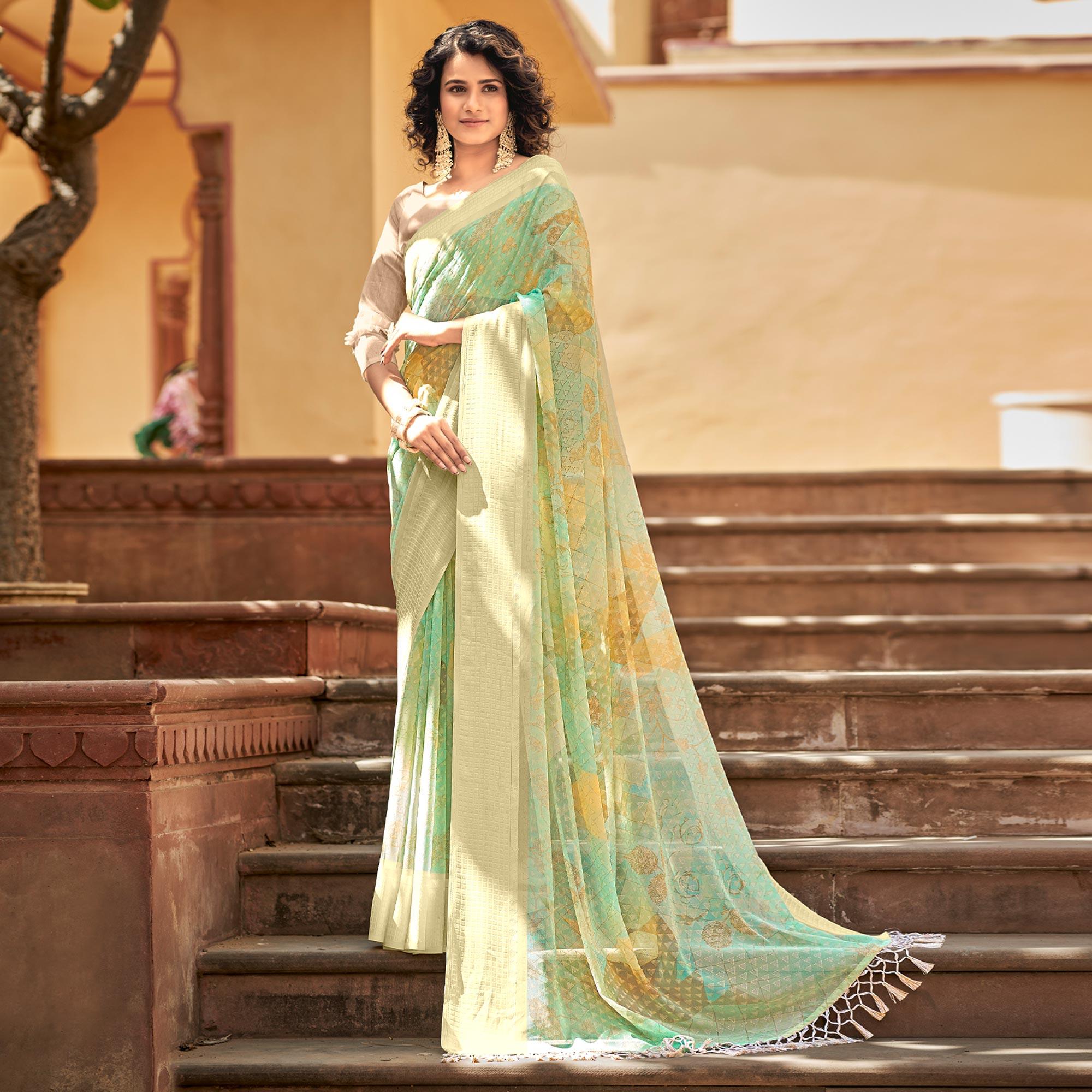 Green Printed Georgette Saree With Tassels - Peachmode