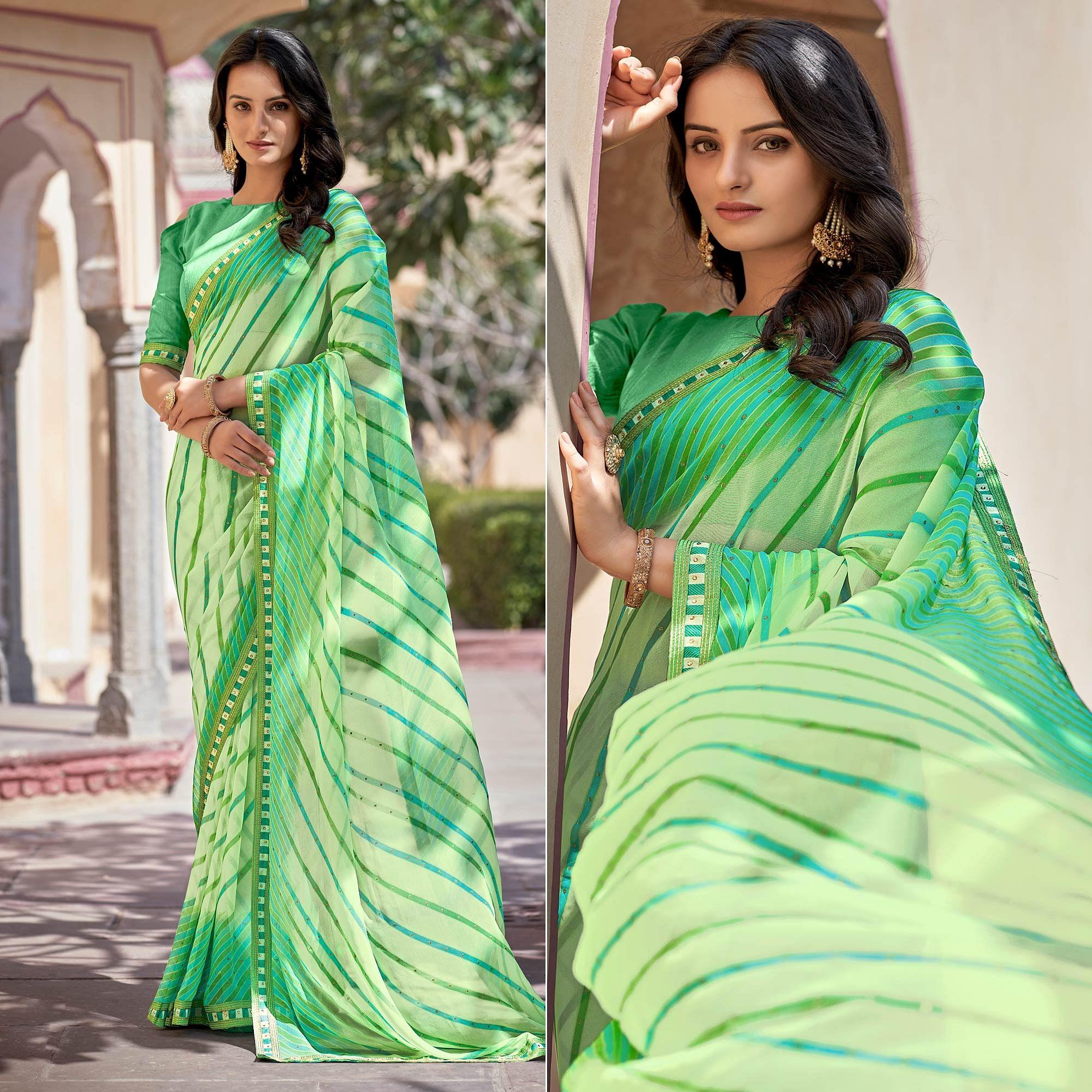 Green Printed With Embellished Georgette Saree - Peachmode