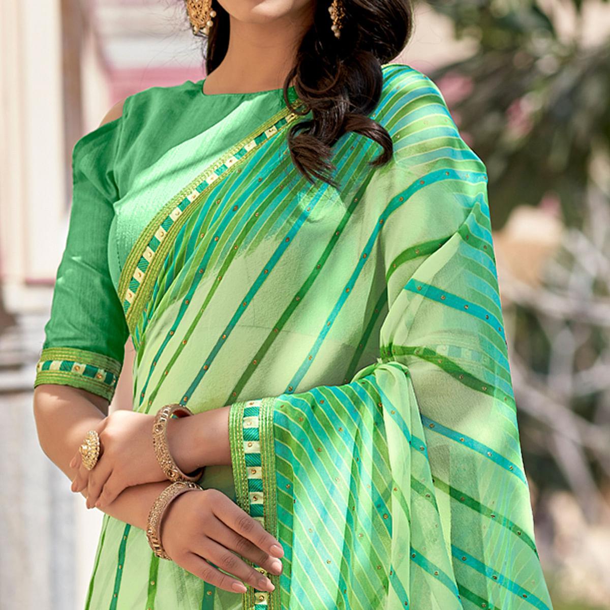 Green Printed With Embellished Georgette Saree - Peachmode
