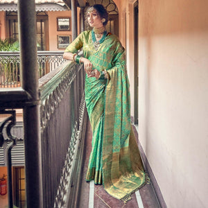 Green Woven Pure Silk Saree With Tassels - Peachmode