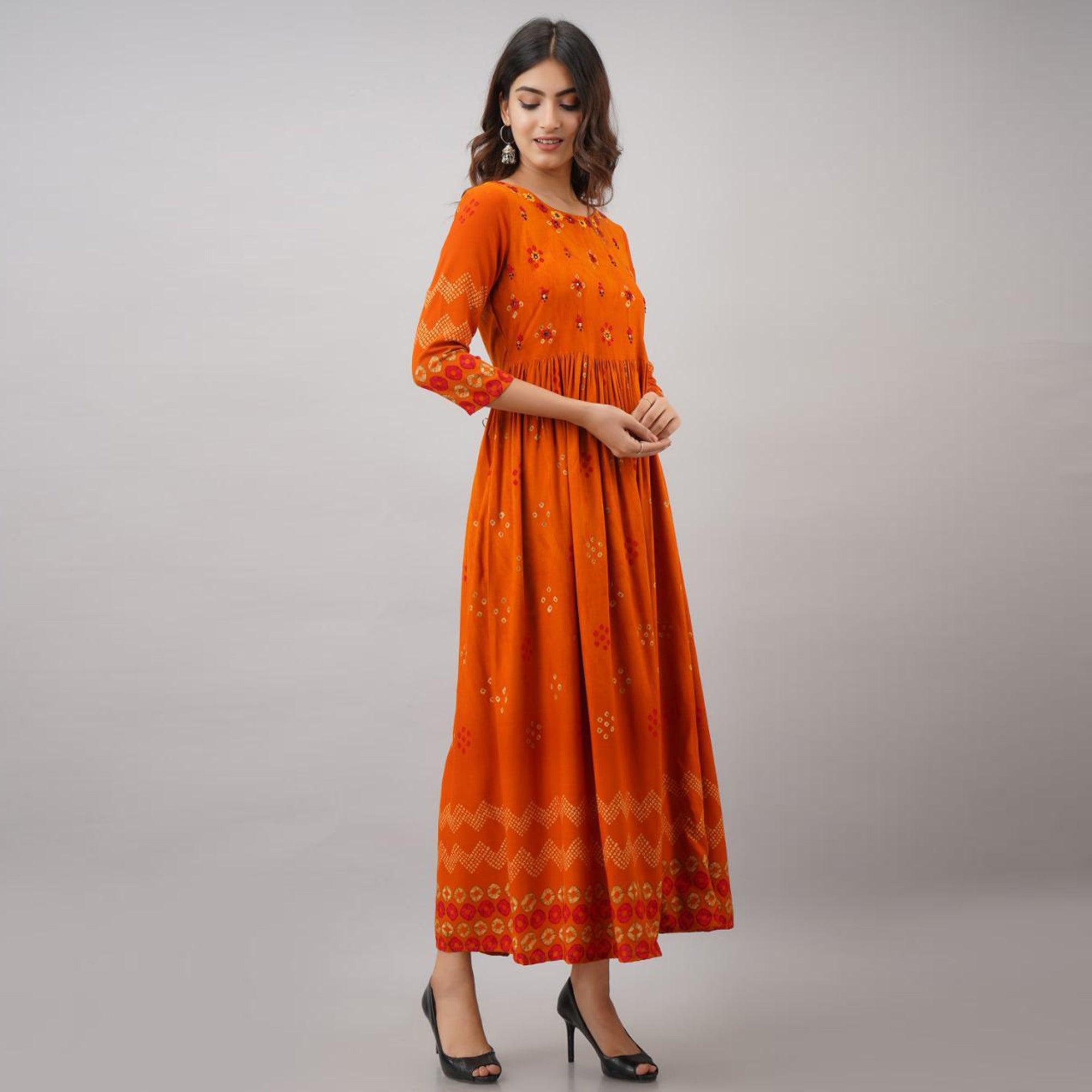 Impressive Orange Colored Partywear Embroidered Muslin Long Kurti - Peachmode
