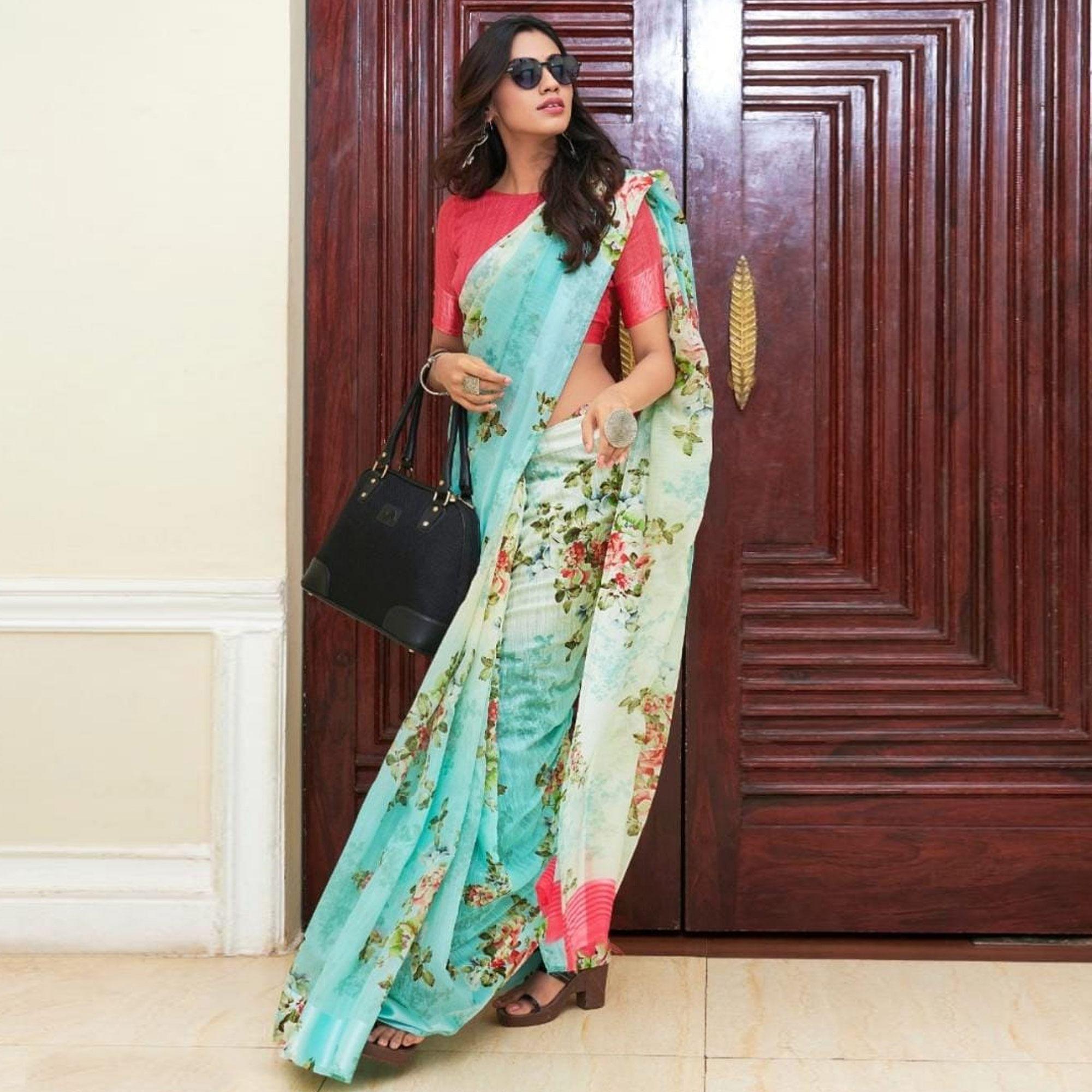 Intricate Aqua Blue Colored Casual Wear Floral Printed Linen Saree - Peachmode