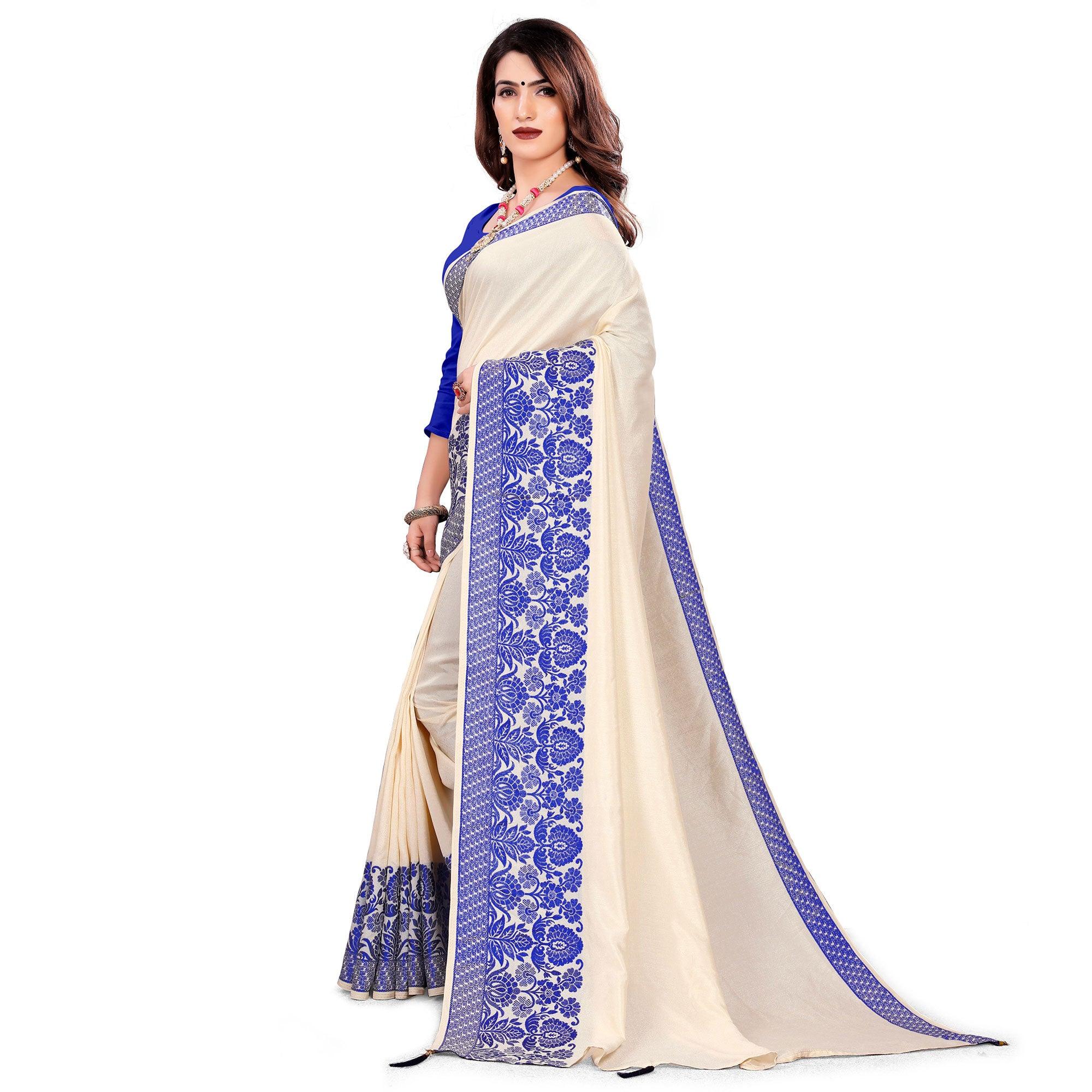 Intricate Cream Colored Festive Wear Woven Art Silk Saree With Tassels - Peachmode