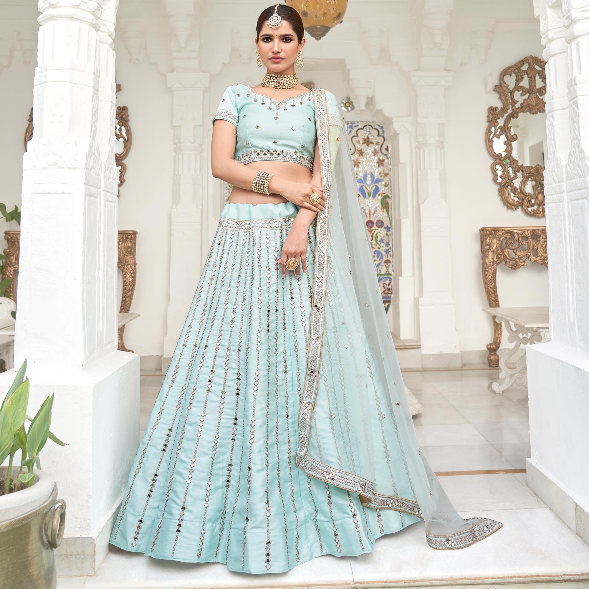 Intricate Ice Blue Coloured Wedding Wear Mirror Work Heavy Silk Lehenga Choli - Peachmode