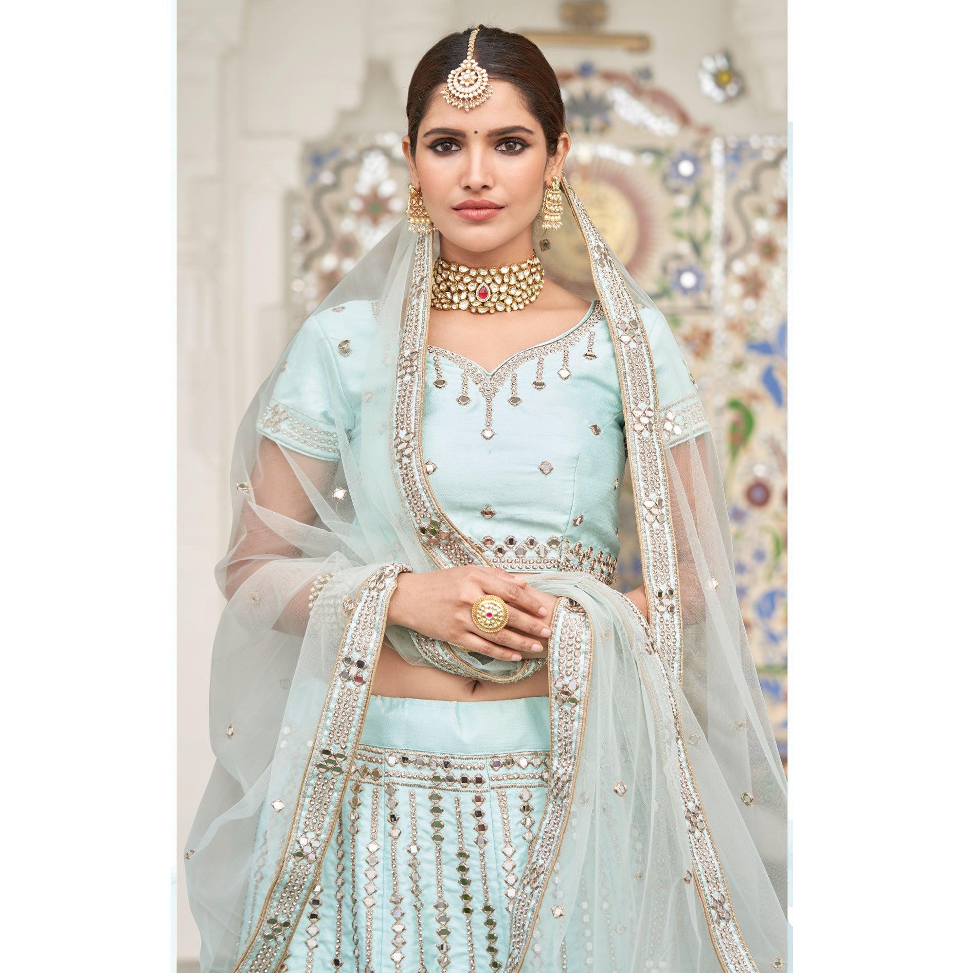 Intricate Ice Blue Coloured Wedding Wear Mirror Work Heavy Silk Lehenga Choli - Peachmode