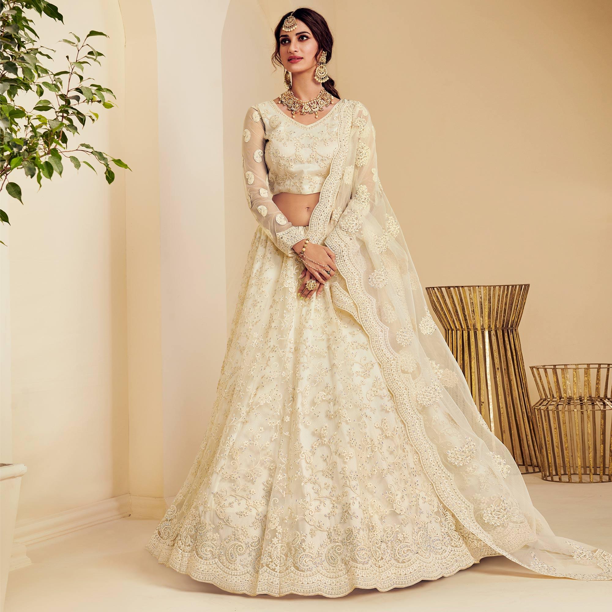 Intricate Off White Coloured Wedding Wear Cording Embroidered Net Lehenga Choli - Peachmode