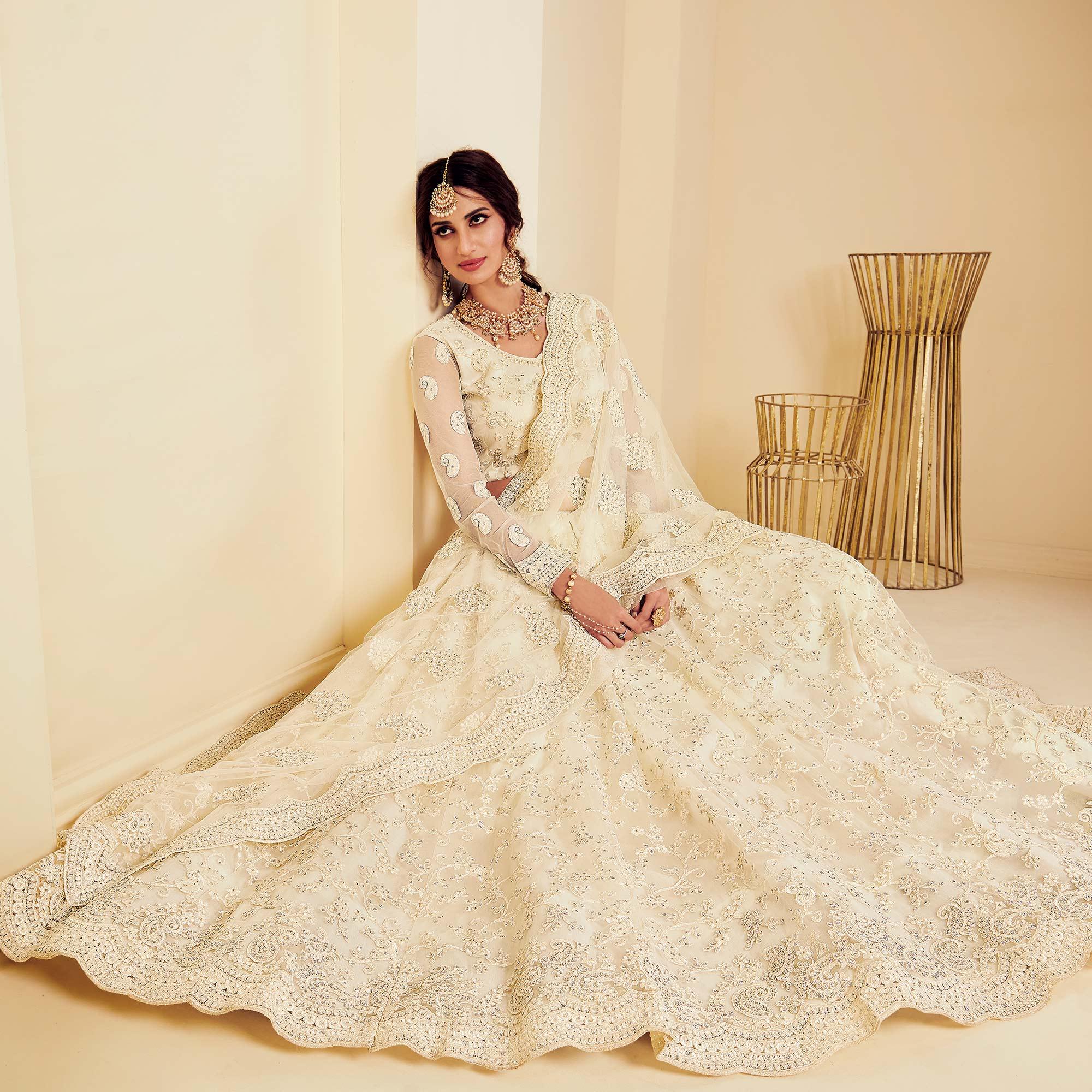 Intricate Off White Coloured Wedding Wear Cording Embroidered Net Lehenga Choli - Peachmode