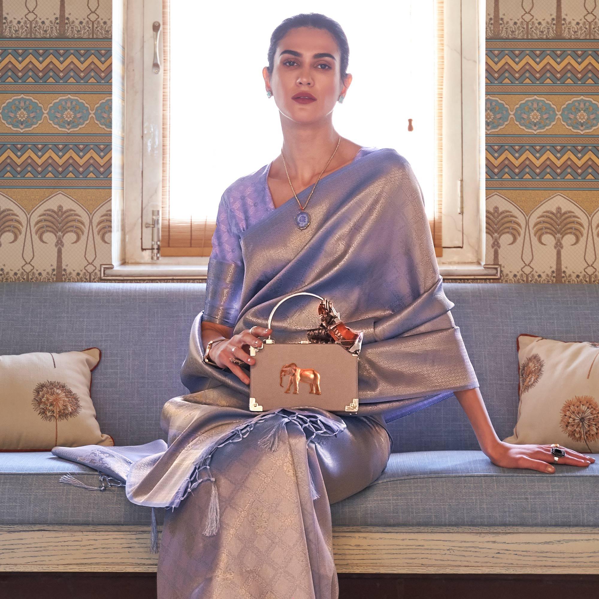 Lavender Woven Art Silk Saree With Tassels - Peachmode