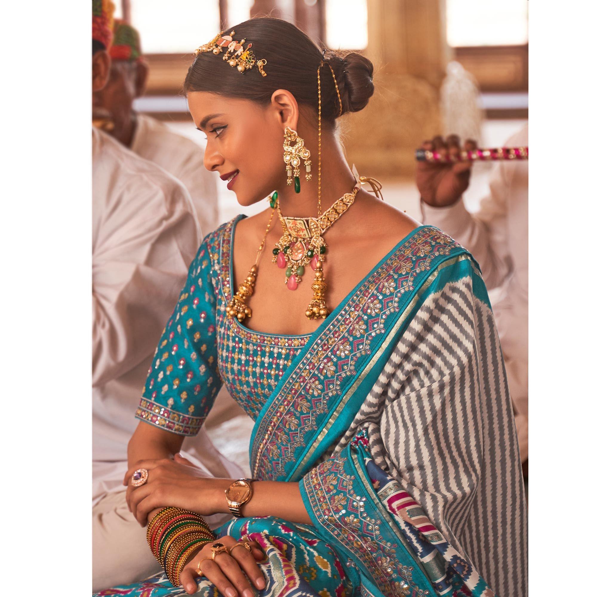 Light Blue & Off White Patola Printed-Sequence Embroidered Pure Silk Saree - Peachmode