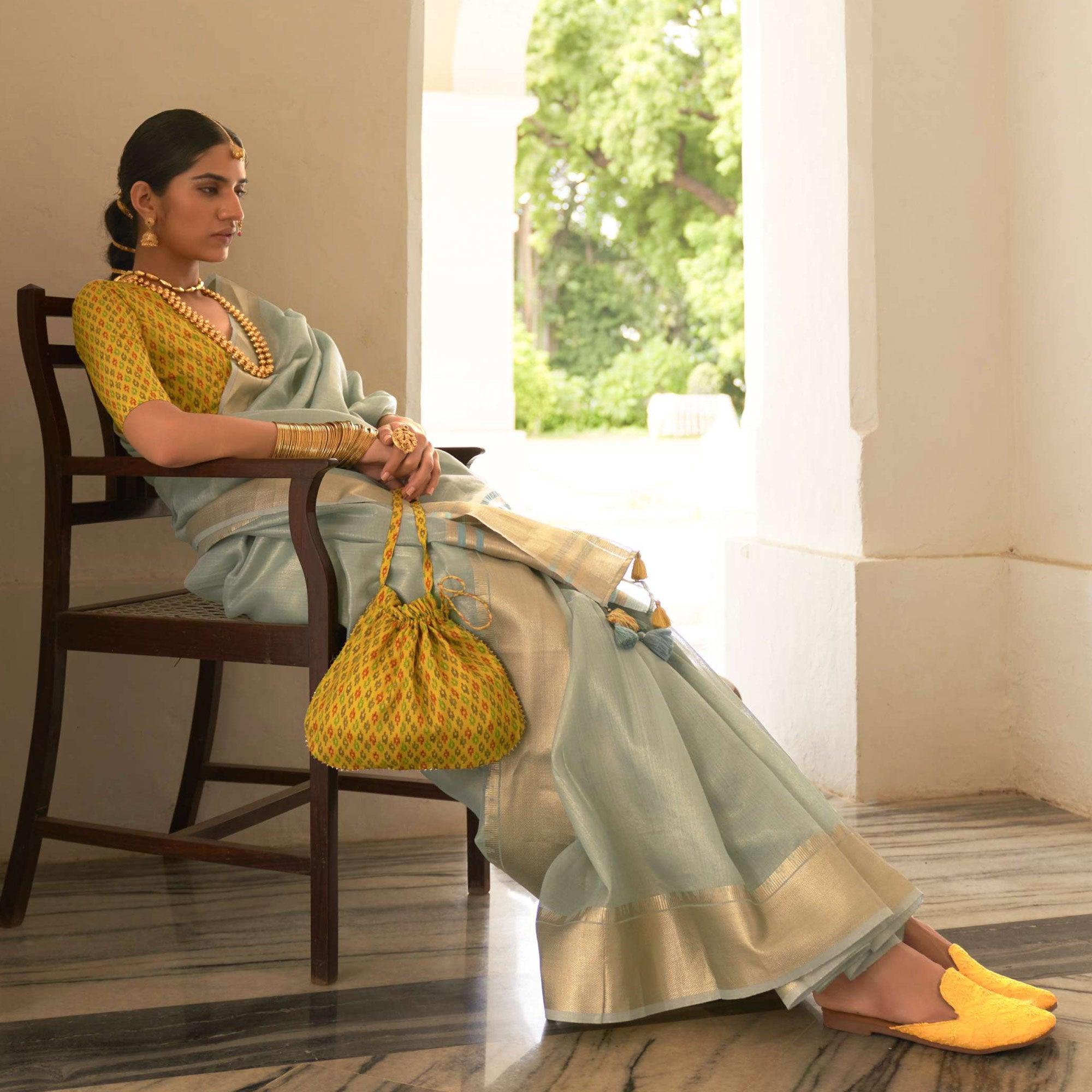 Light Blue Woven Organza Saree With Tassels - Peachmode