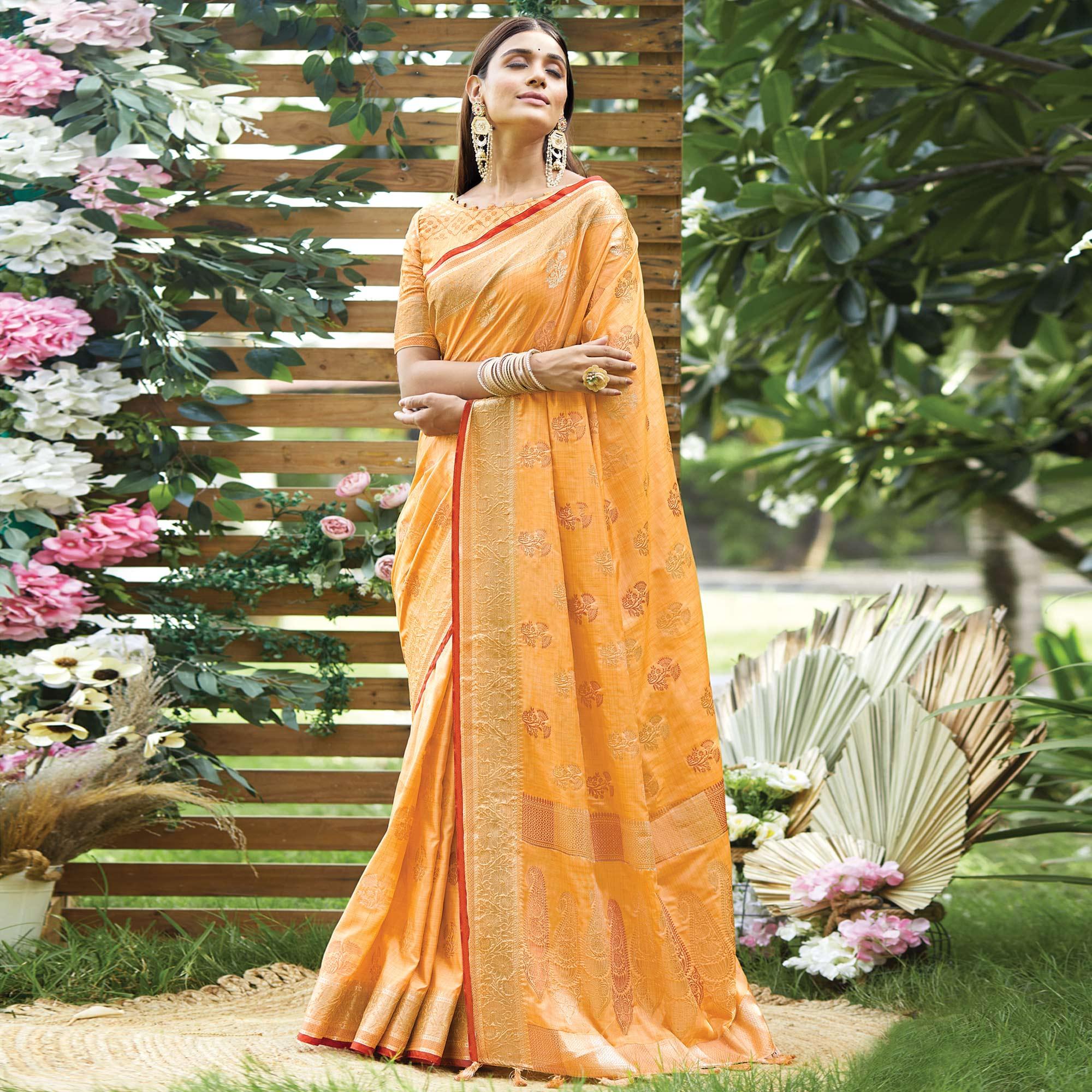 Light Orange Woven Raw Silk Saree With Tassels - Peachmode