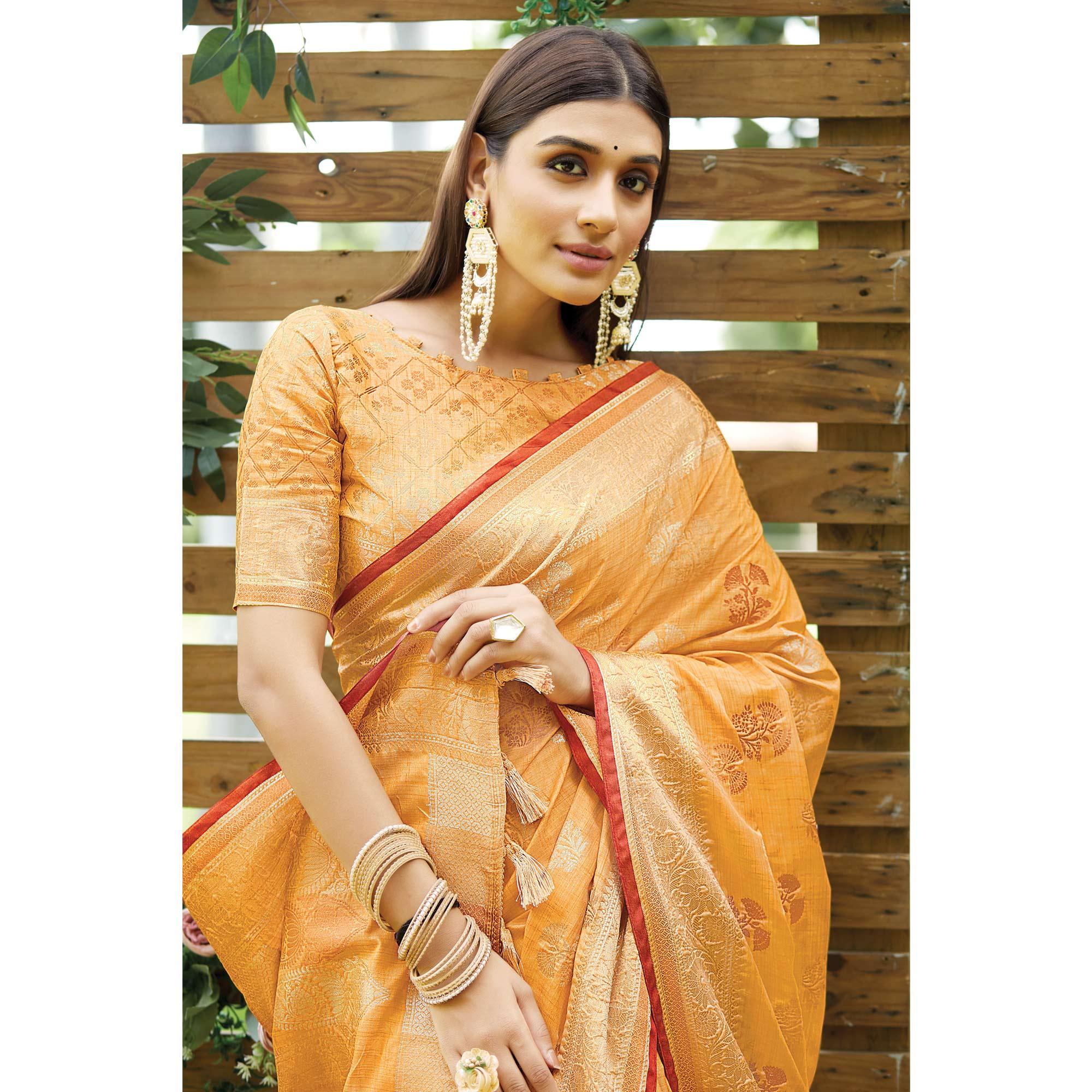Light Orange Woven Raw Silk Saree With Tassels - Peachmode