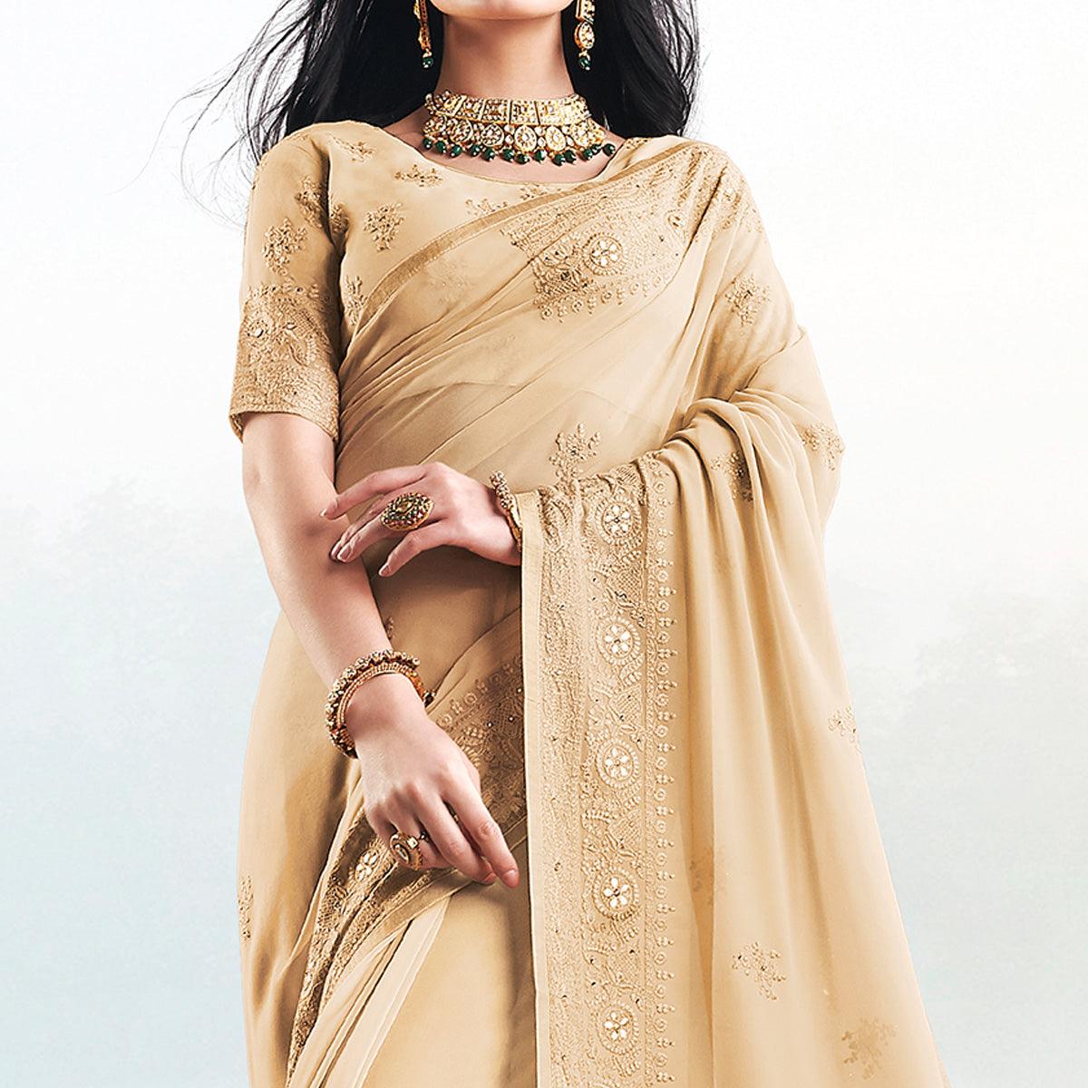 Magnetic Beige Colored Partywear Embroidered Georgette Saree - Peachmode