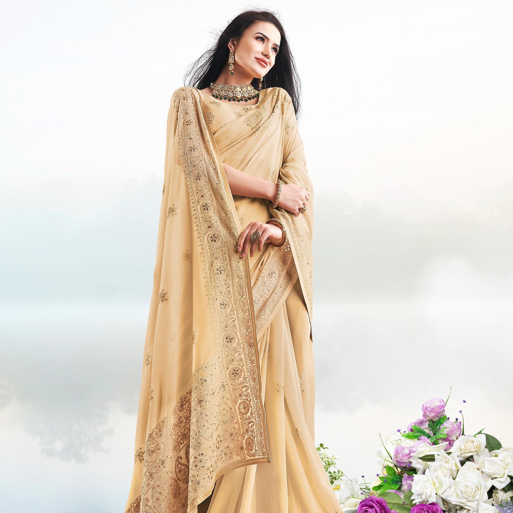Magnetic Beige Colored Partywear Embroidered Georgette Saree - Peachmode
