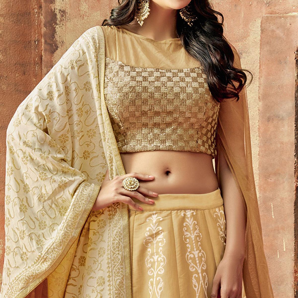 Magnetic Beige Colored Partywear Embroidered Silk Lehenga Choli - Peachmode