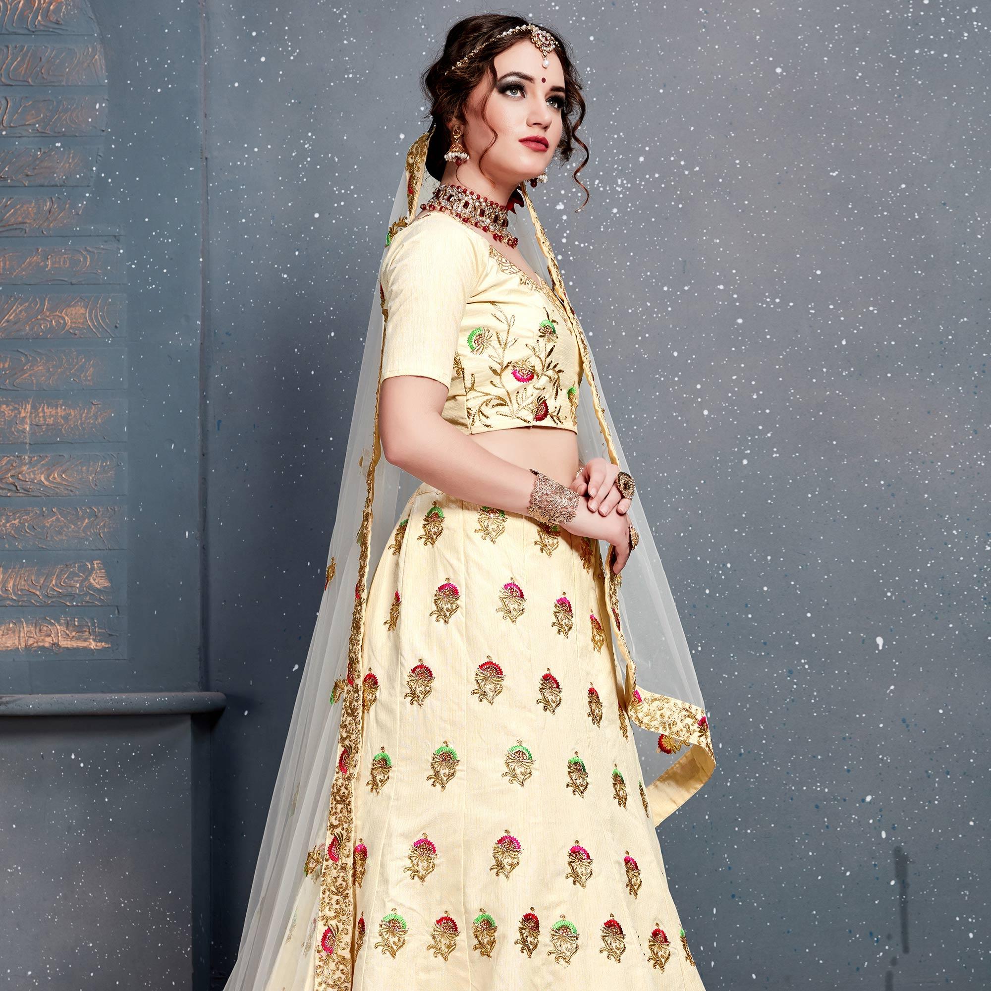 Magnetic Cream Colored Wedding Wear Embroidered Silk Lehenga Choli - Peachmode