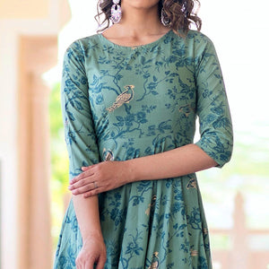 Magnetic Light Aqua Colored Partywear Printed Muslin Blend Long Kurti - Peachmode