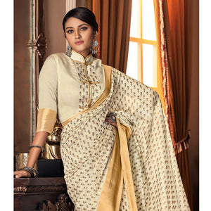 Mesmerising Cream Colored Festive Wear Printed And Woven Border Silk Saree - Peachmode