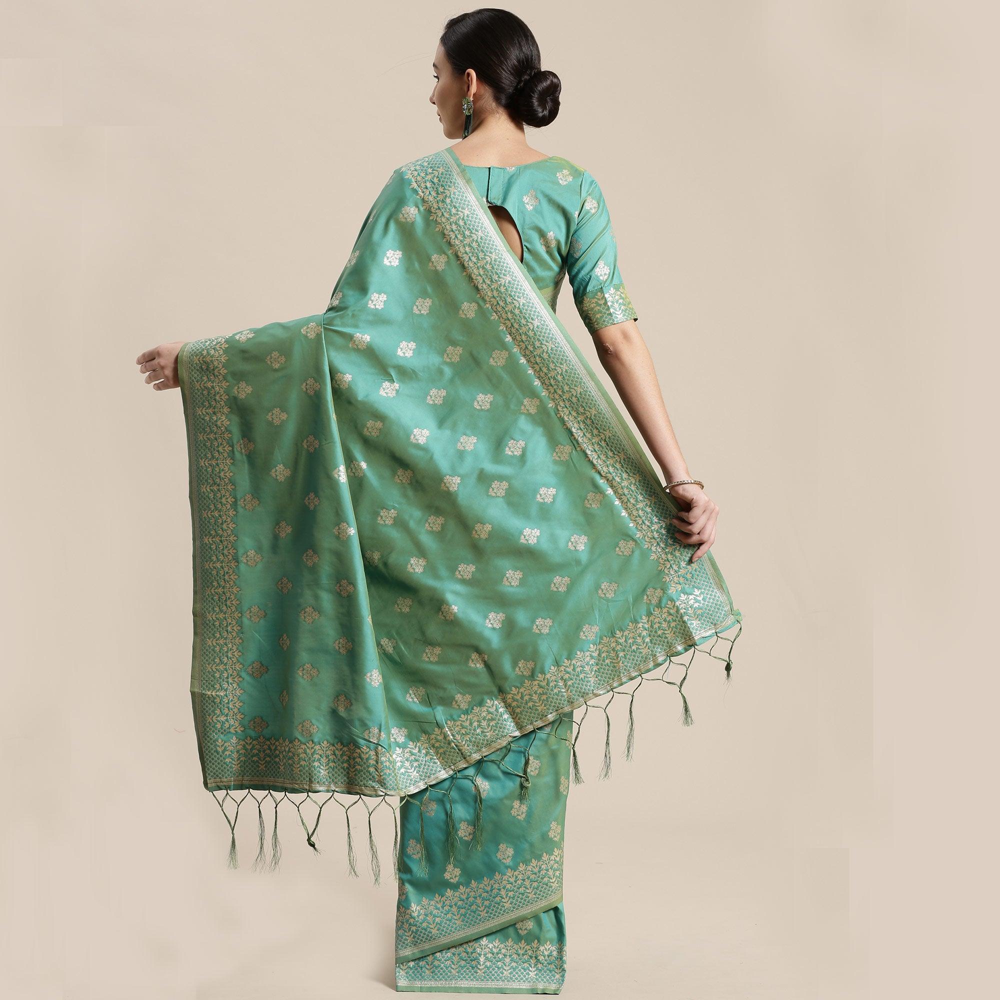 Mesmerising Sea Green Colored Festive Wear Silk Blend Woven Floral Saree With Tassels - Peachmode