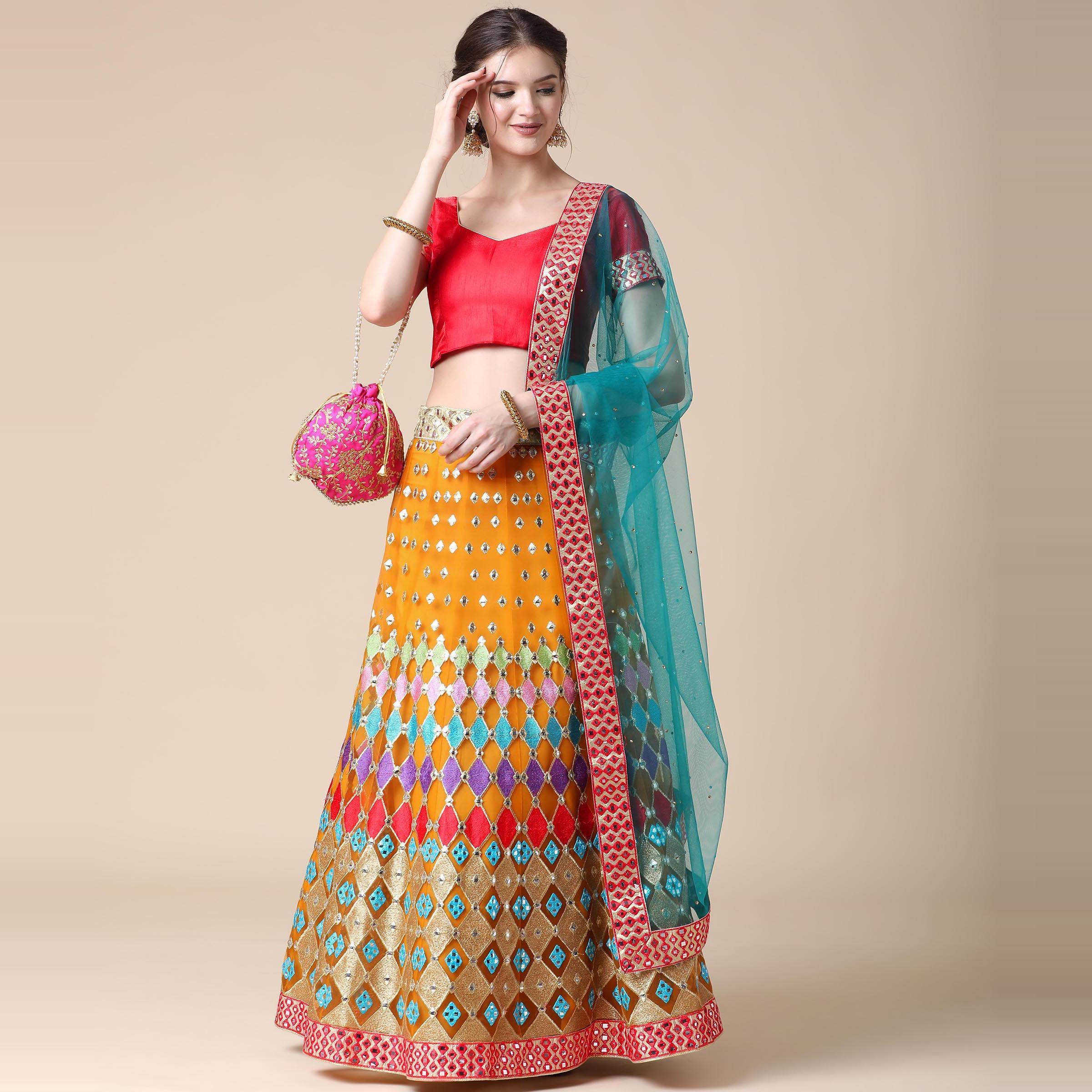 Mustard Partywear Embroidered & Mirror Work Heavy Soft Net Lehenga - Peachmode