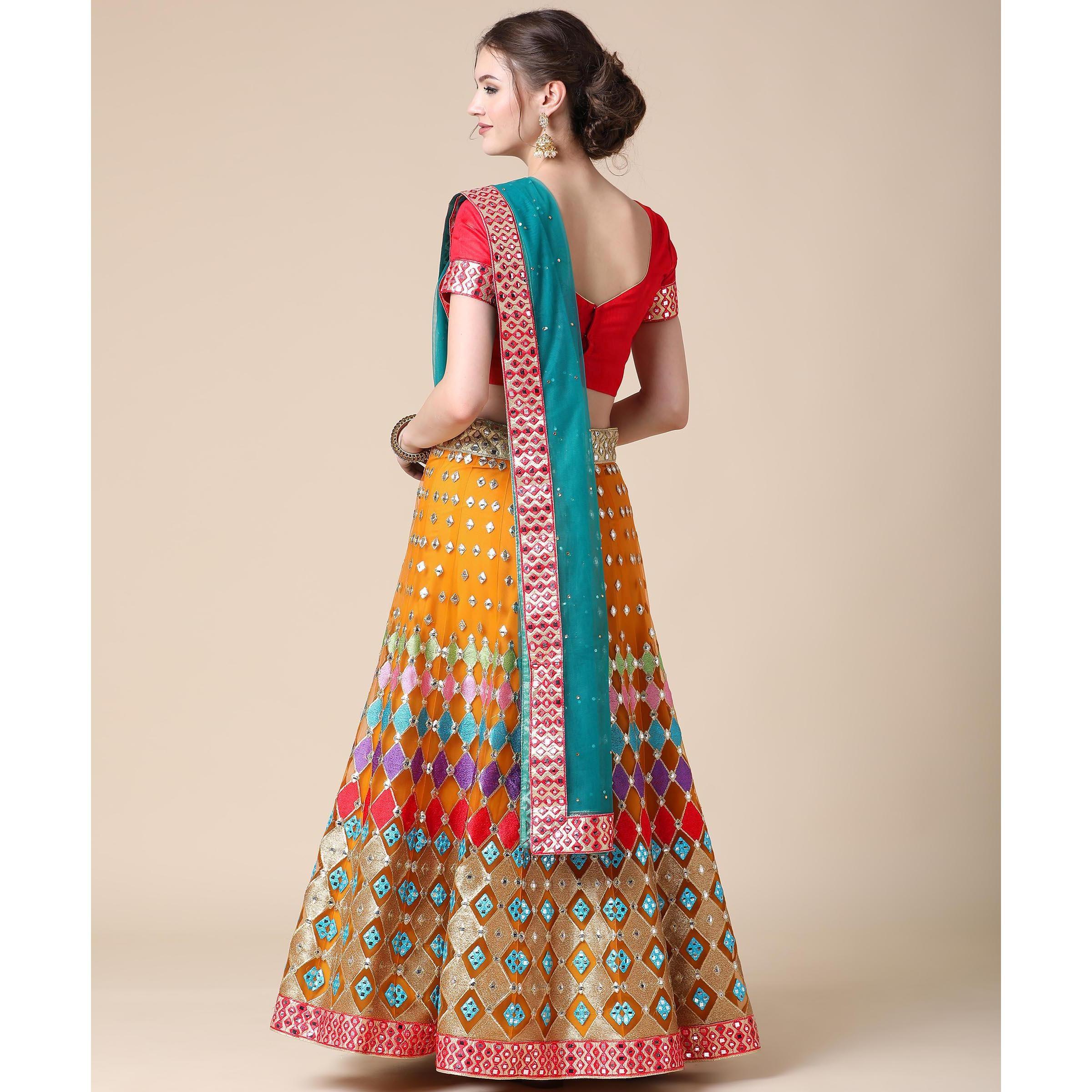 Mustard Partywear Embroidered & Mirror Work Heavy Soft Net Lehenga - Peachmode