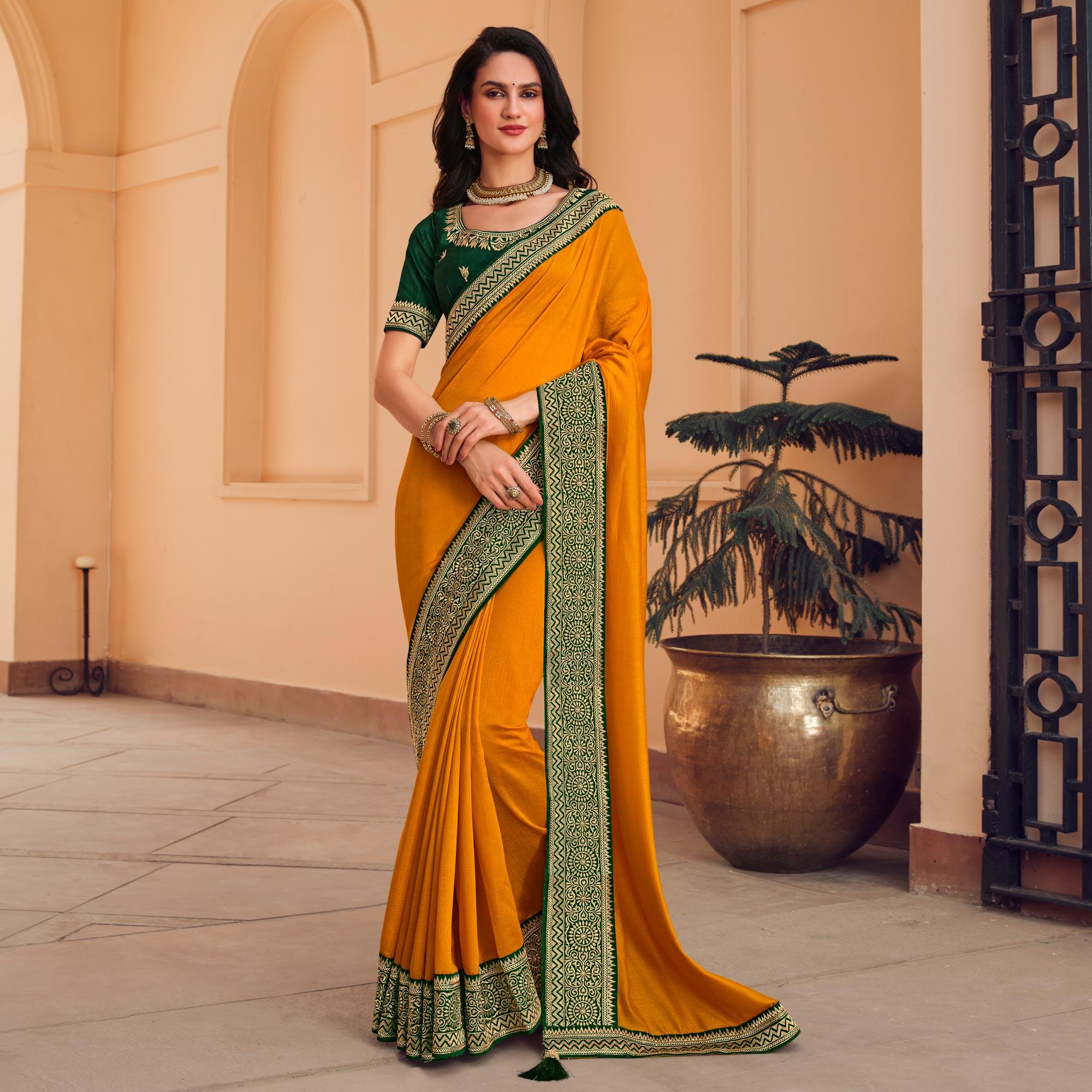 Mustard Solid Vichitra Silk Saree With Tassels - Peachmode