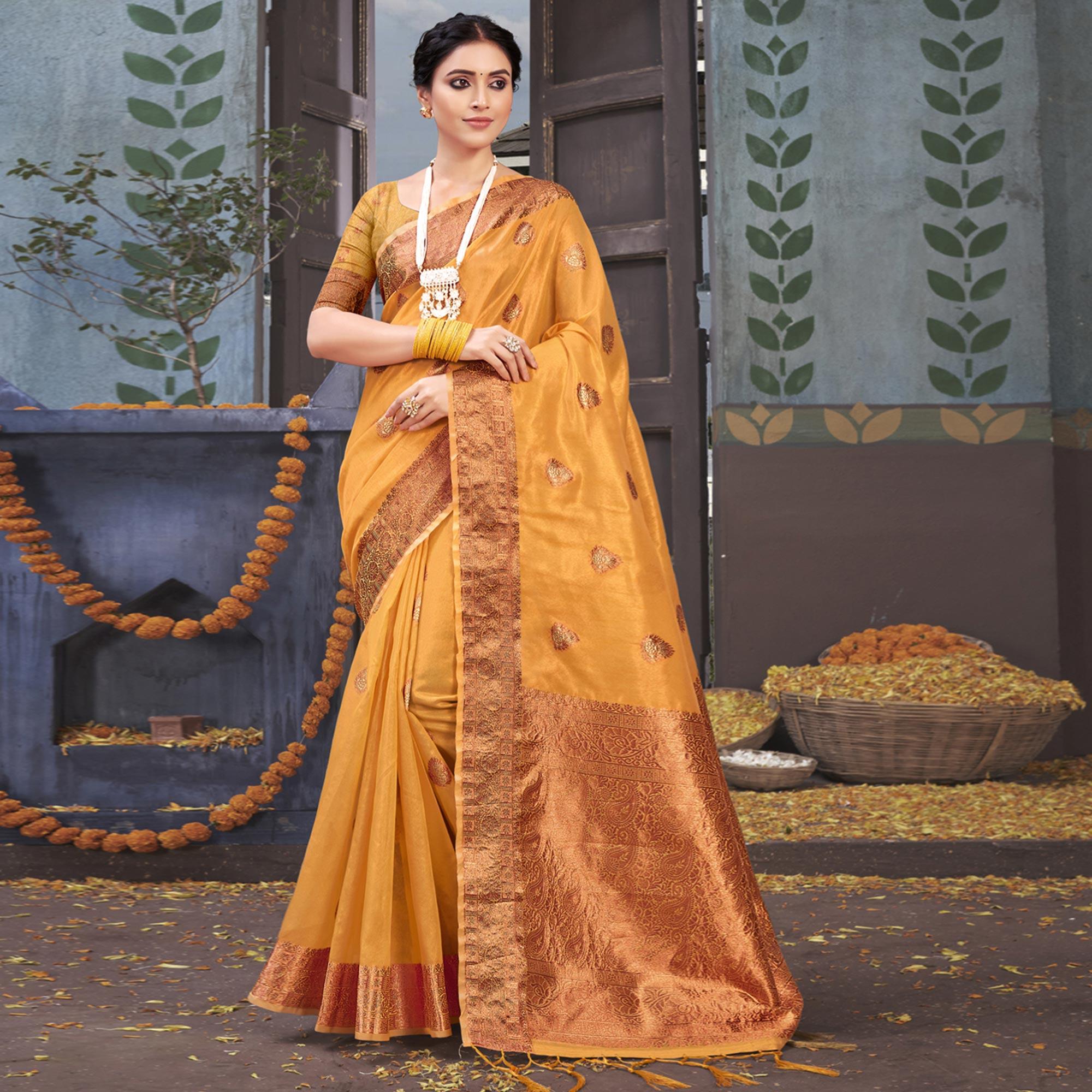 Mustard Woven Organza Saree With Tassels - Peachmode