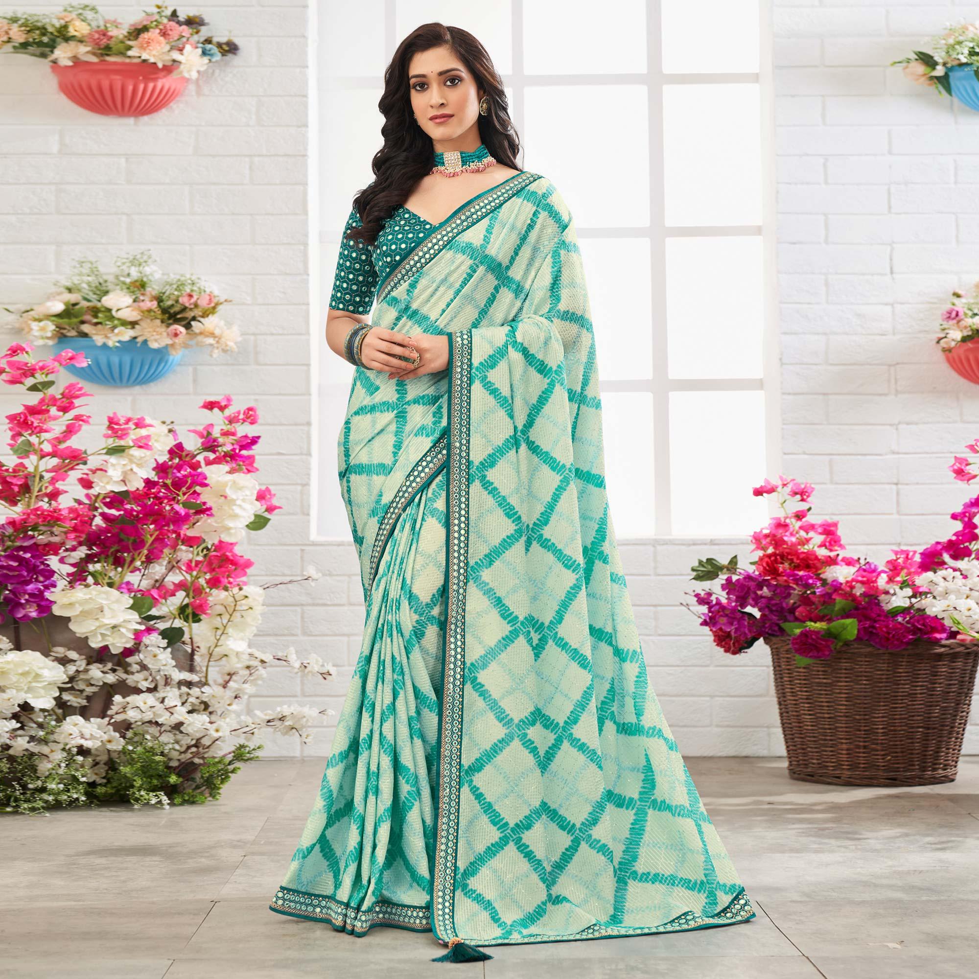 Off White-Blue Printed With Embellished Chiffon Saree With Tassels - Peachmode