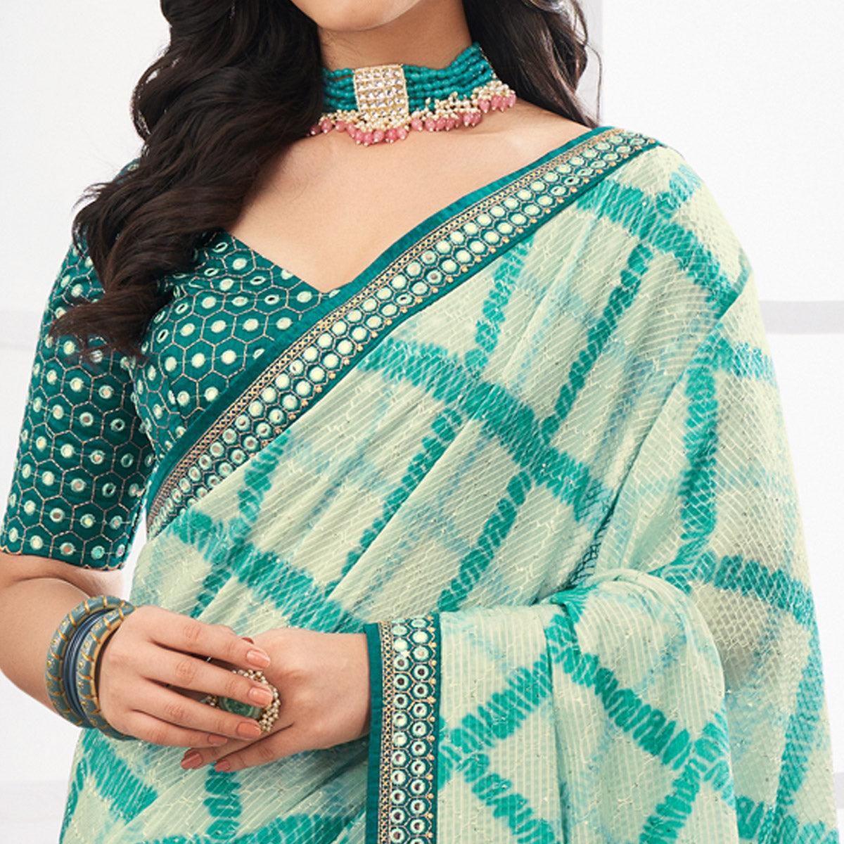 Off White-Blue Printed With Embellished Chiffon Saree With Tassels - Peachmode