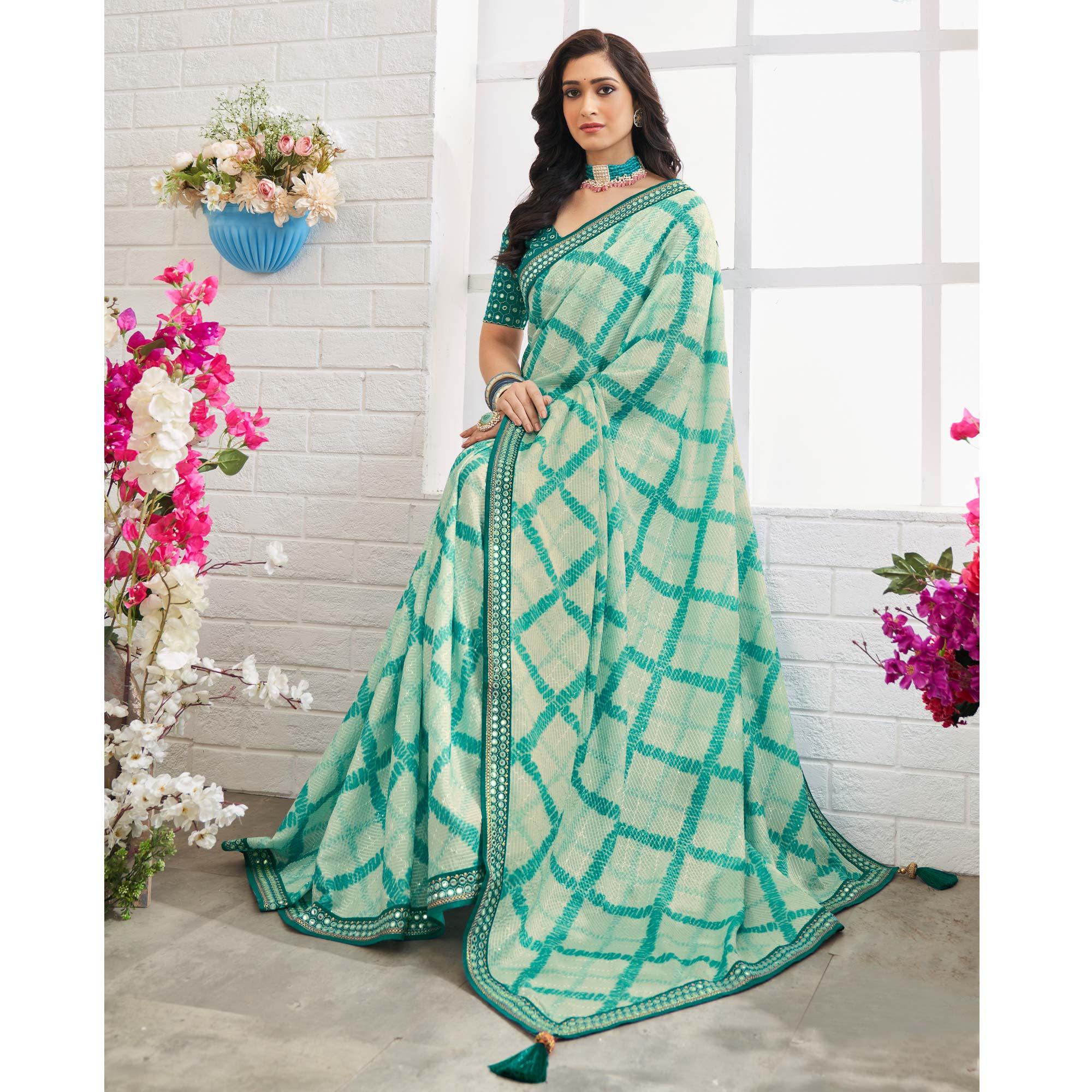 Off White-Blue Printed With Embellished Chiffon Saree With Tassels - Peachmode