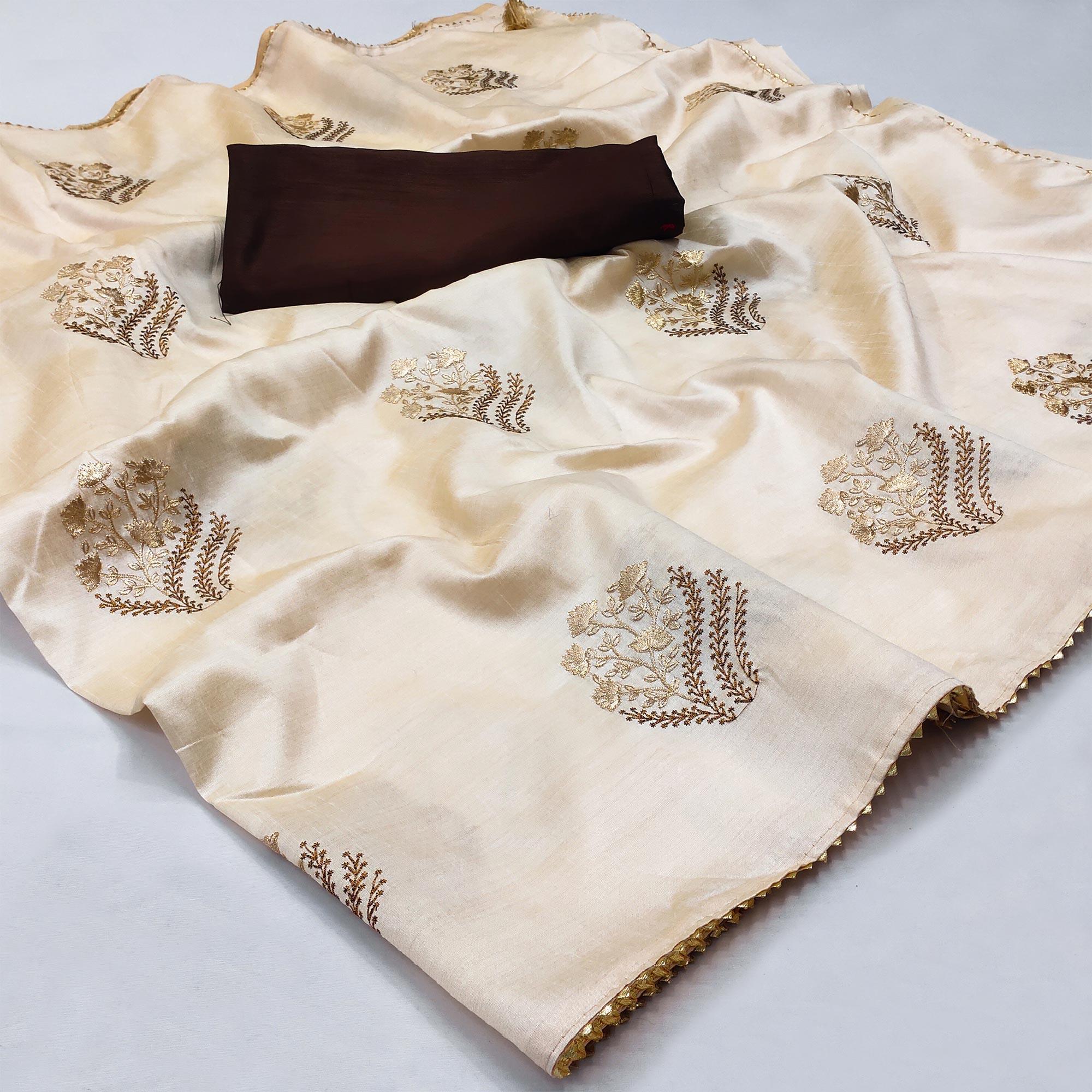 Off White Floral Embroidered Silk Saree - Peachmode