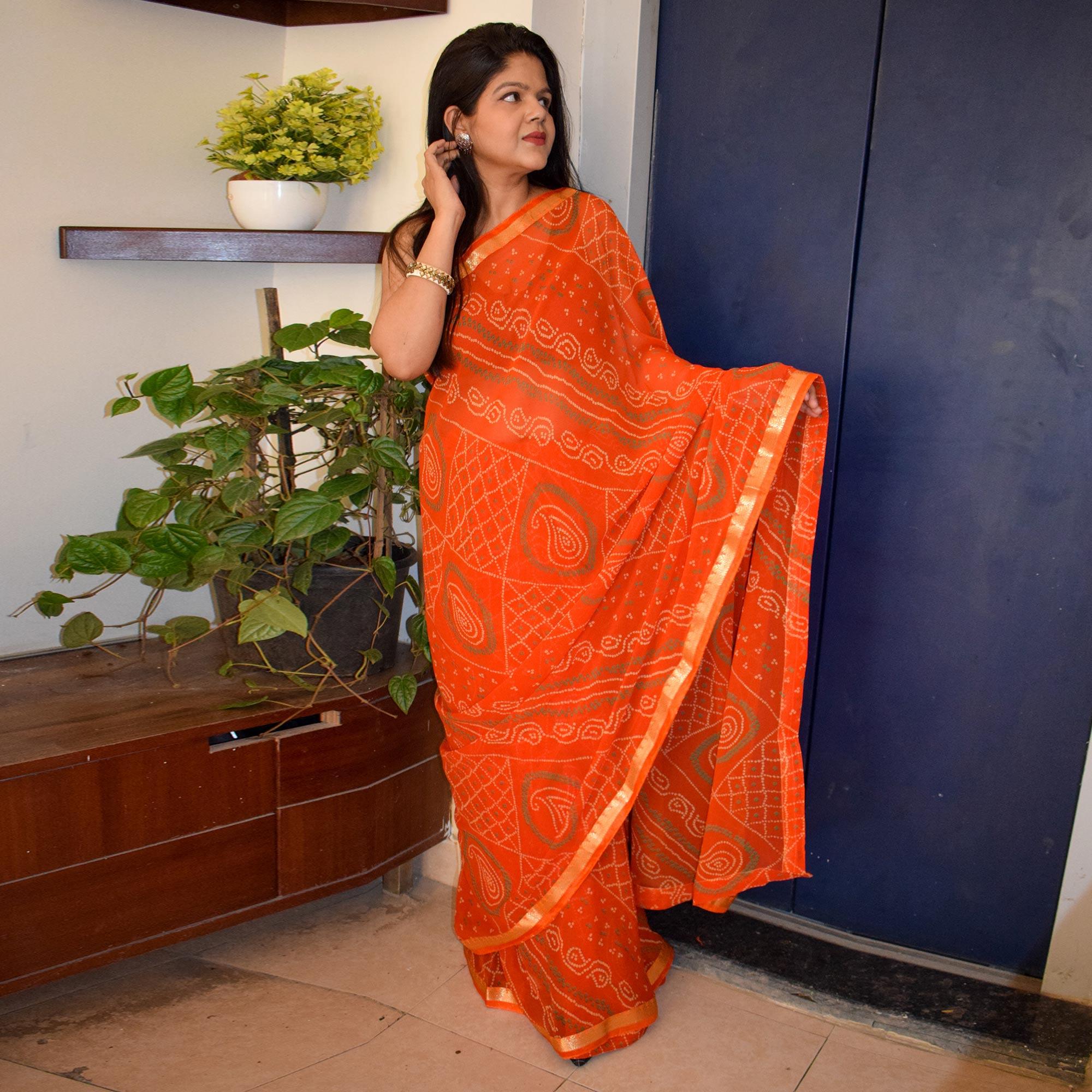 Orange Casual Wear Bandhani Printed Georgette Saree With Fancy Lace - Peachmode