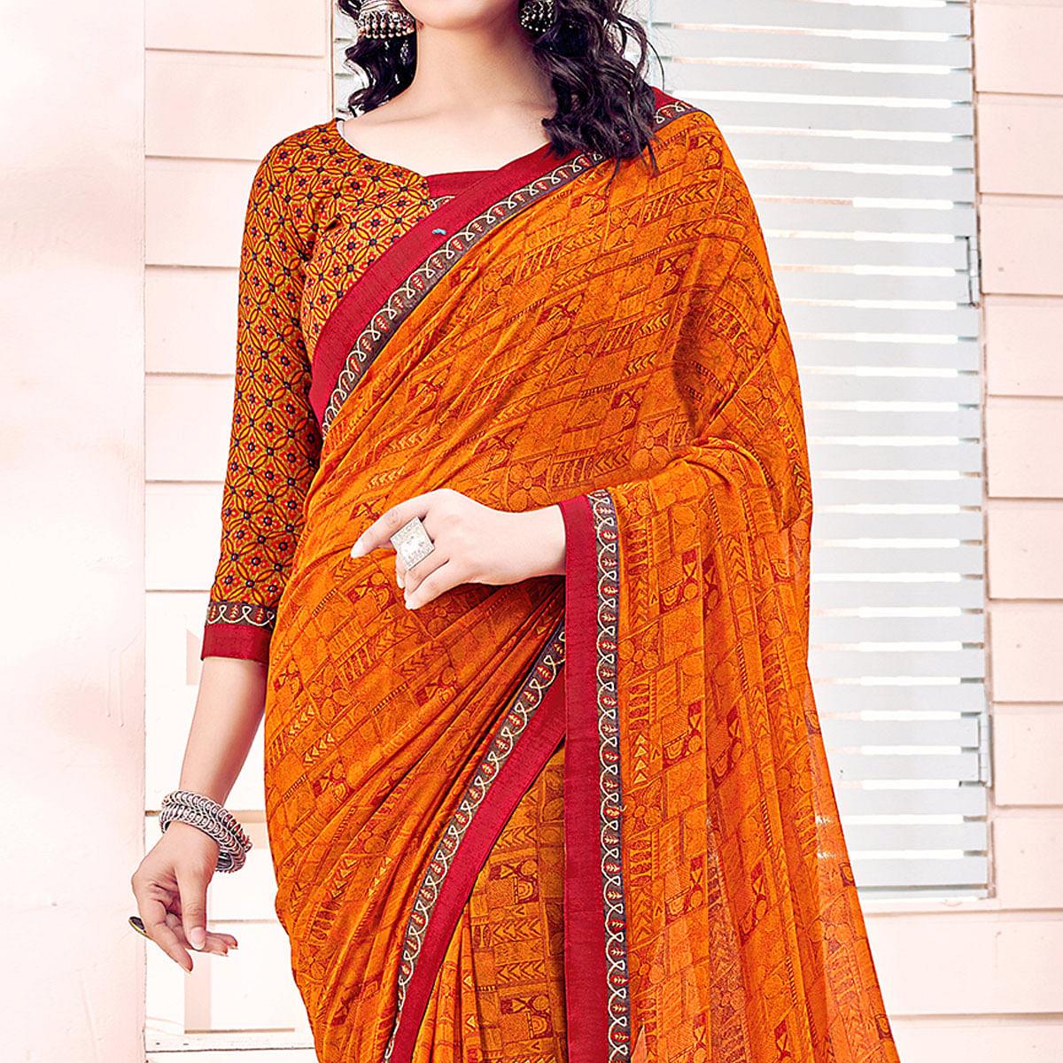 Orange Printed Georgette Saree - Peachmode