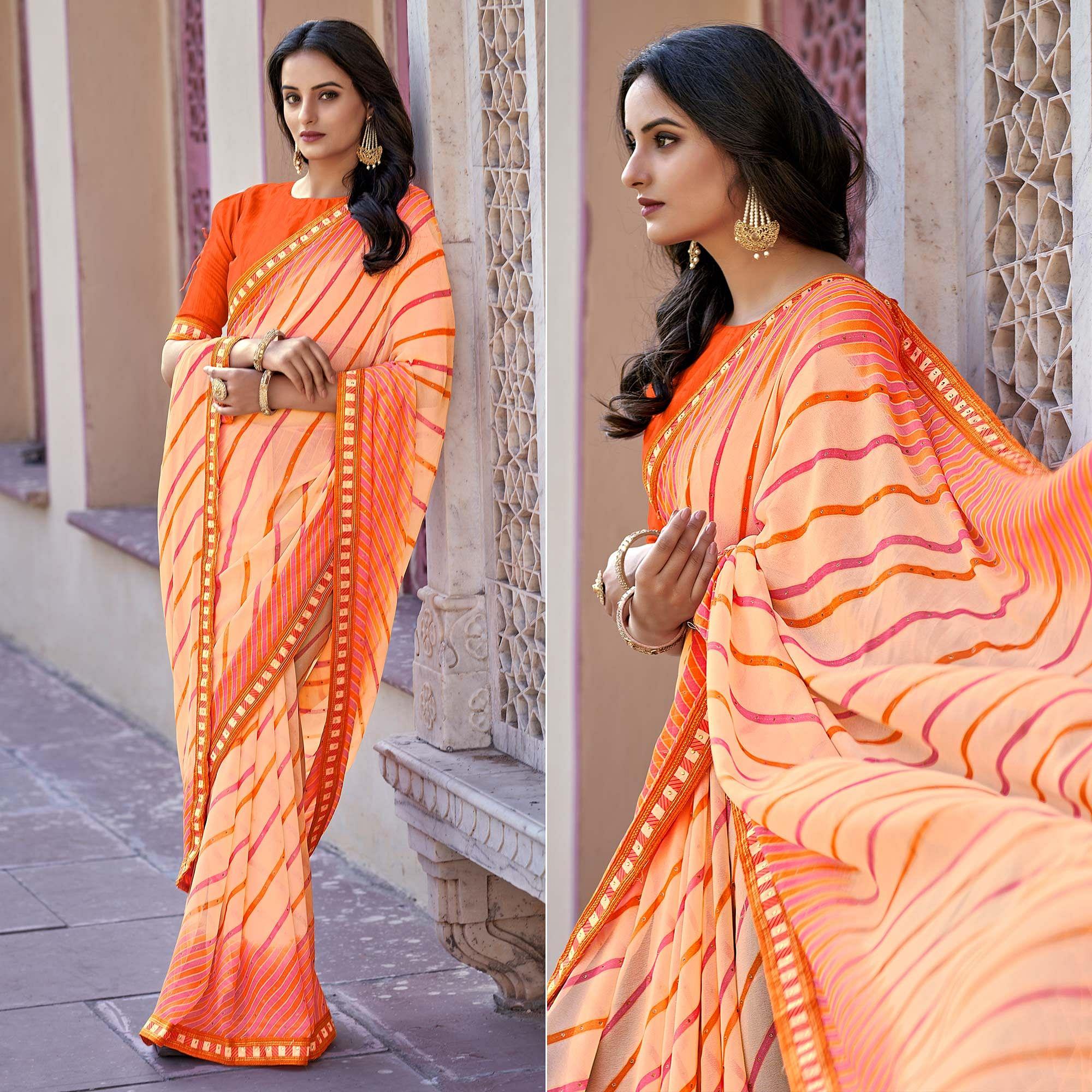 Orange Printed With Embellished Georgette Saree - Peachmode